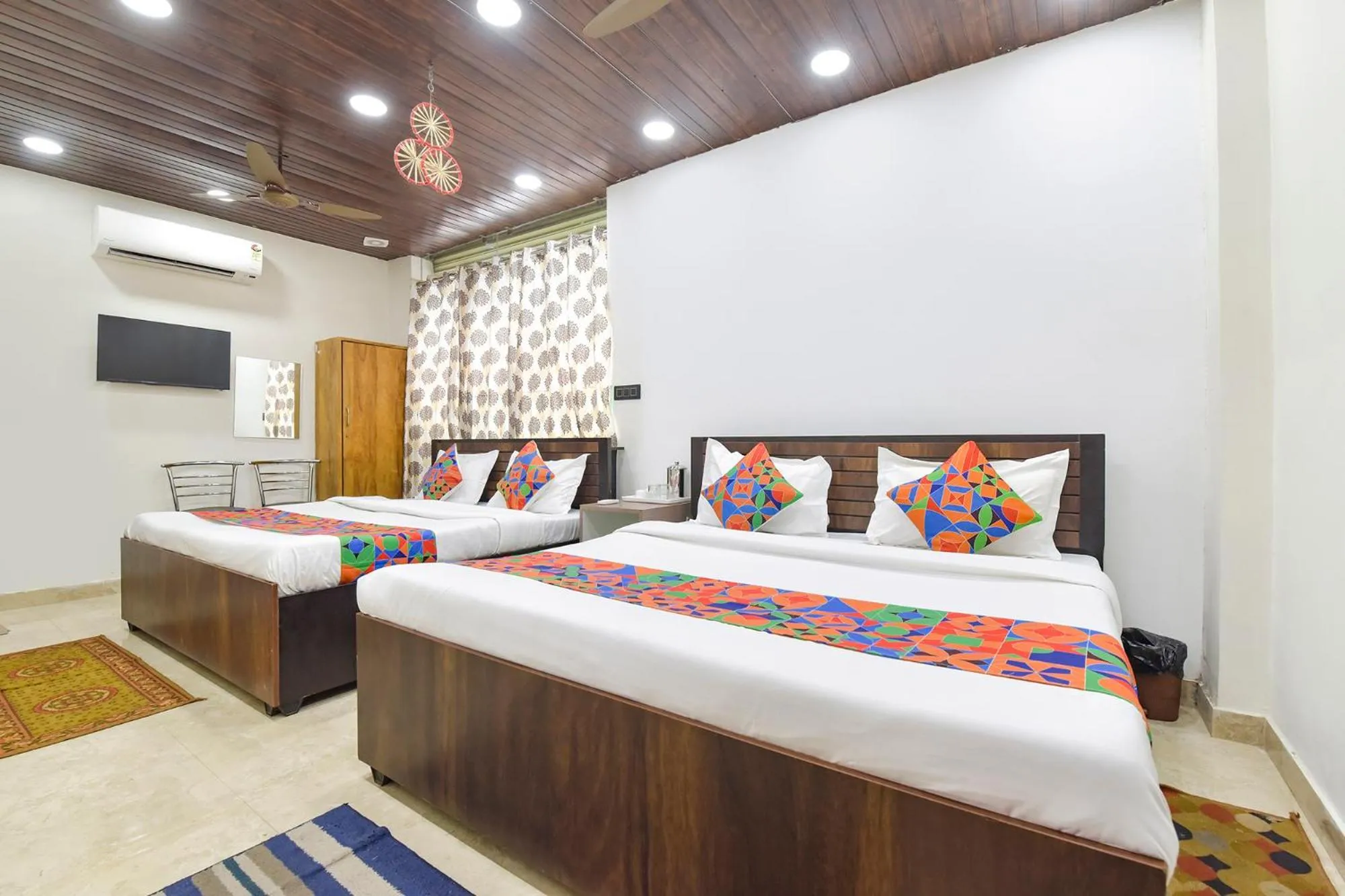 Bed in FabHotel Govindam Royal Stay