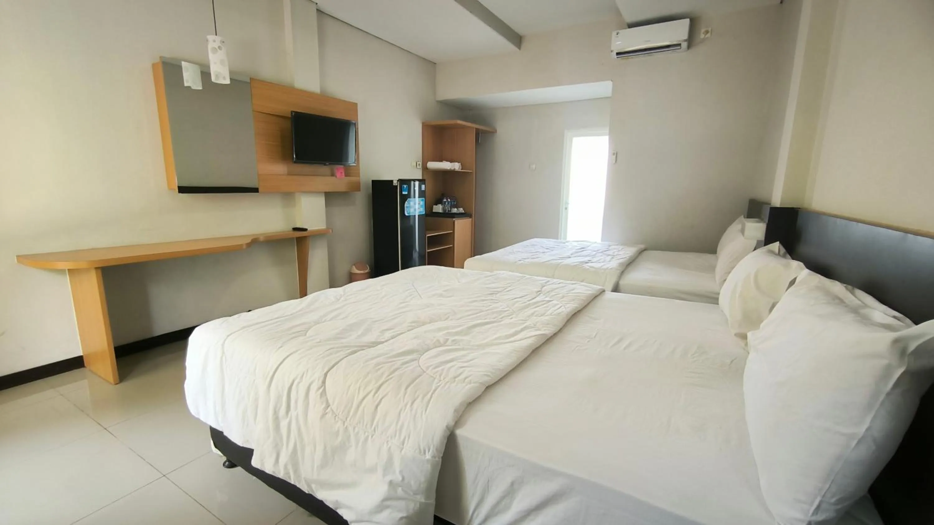 Bed in New Bandengan Beach Hotel