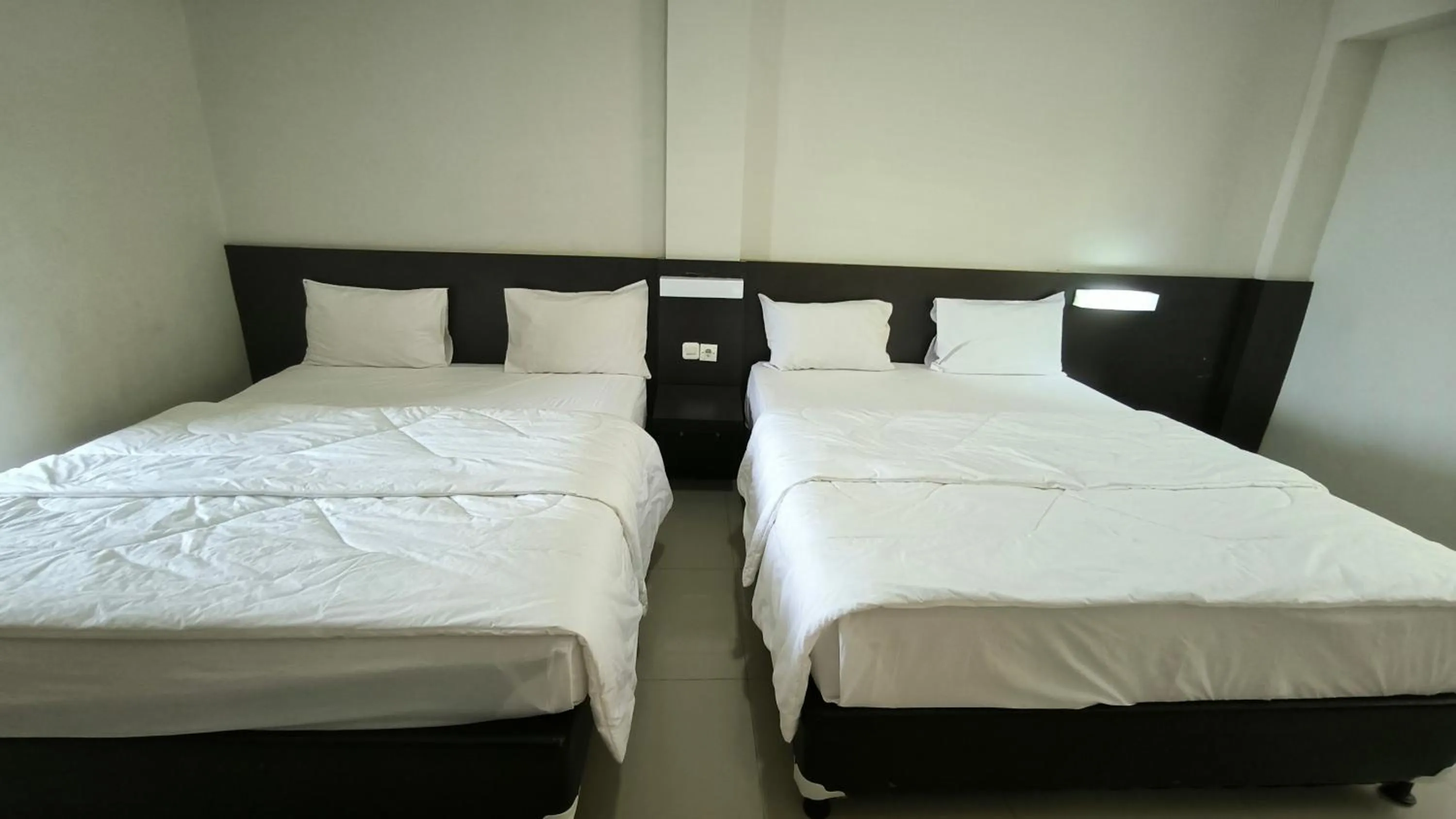 Bed in New Bandengan Beach Hotel