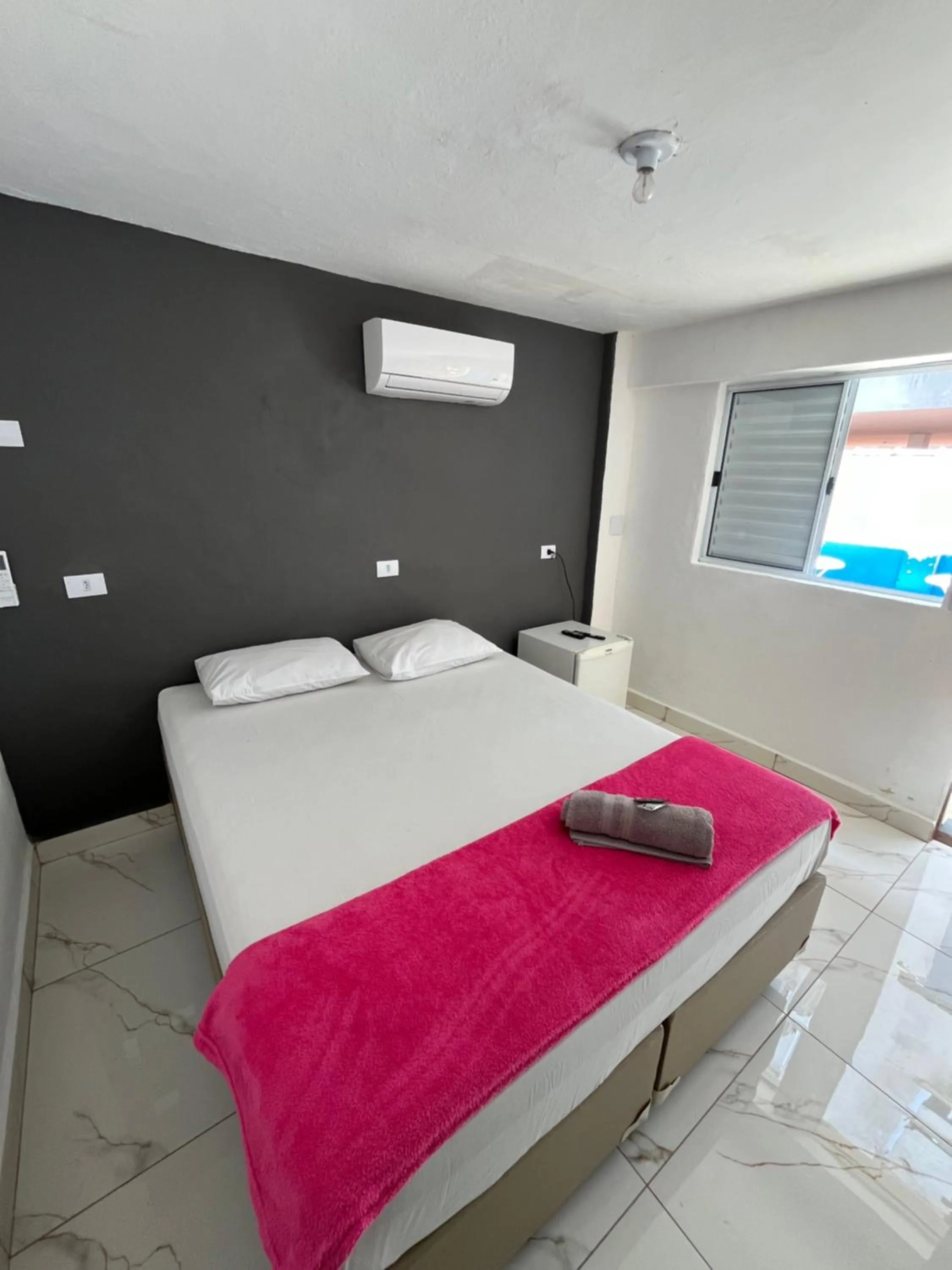 Bed in Pousada Aloha Santos