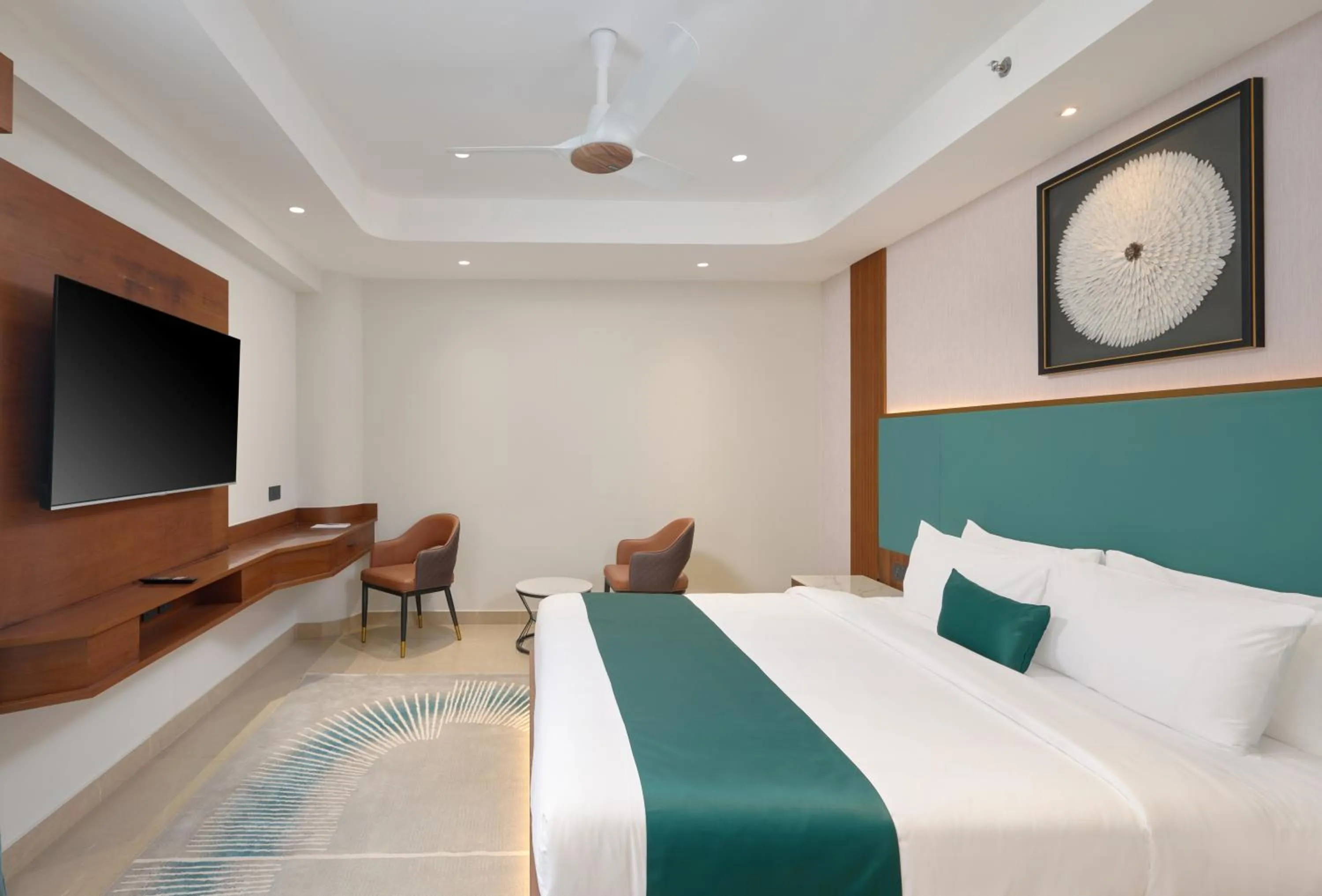 Bed in Kowju Airport Hotel Calicut