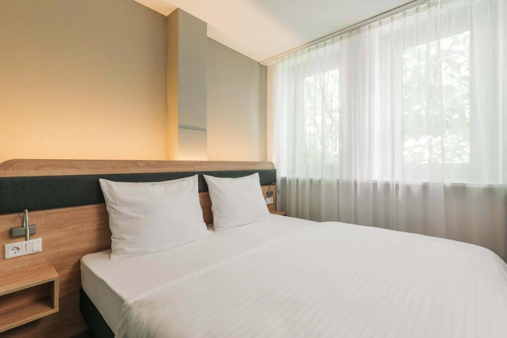 Bed in Homaris Corner Hotel