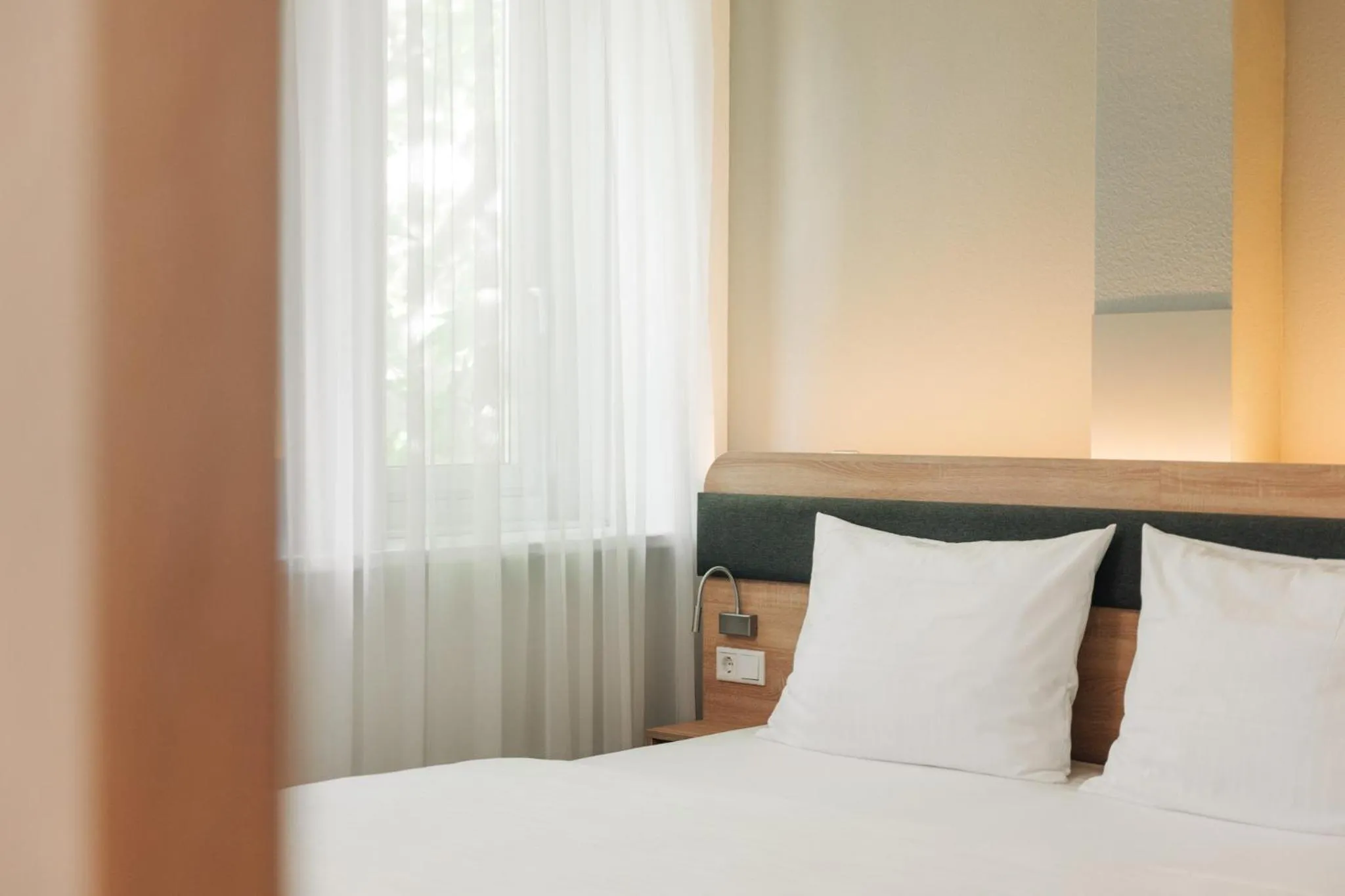 Bed in Homaris Corner Hotel