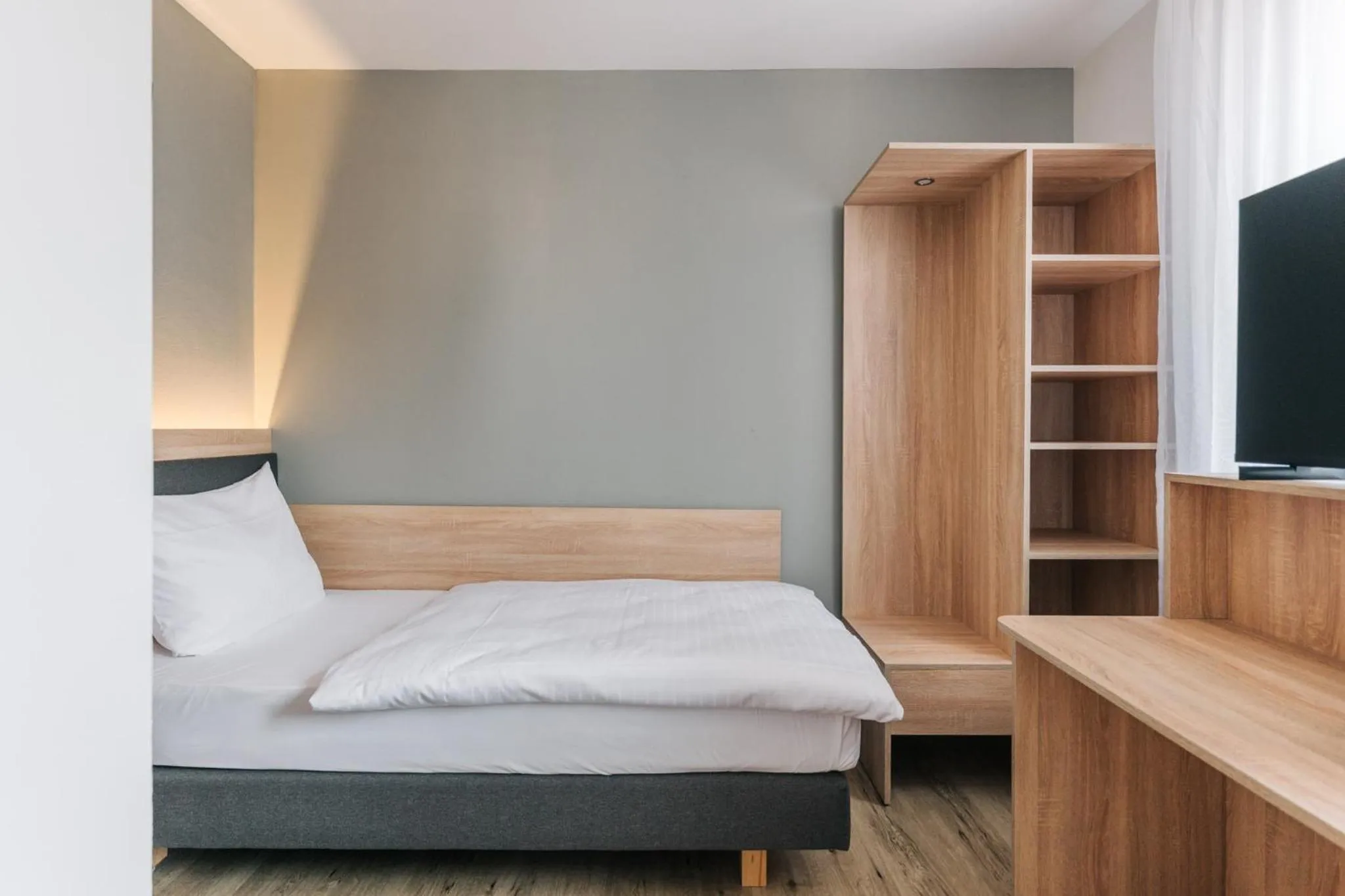 Bed in Homaris Corner Hotel