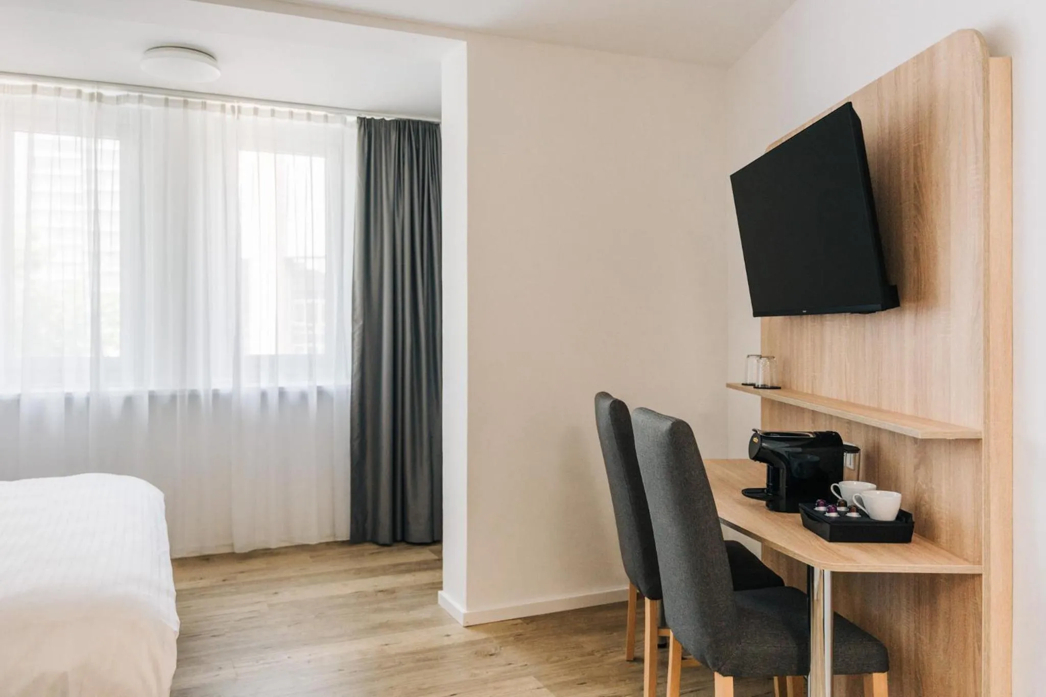 Bed in Homaris Corner Hotel