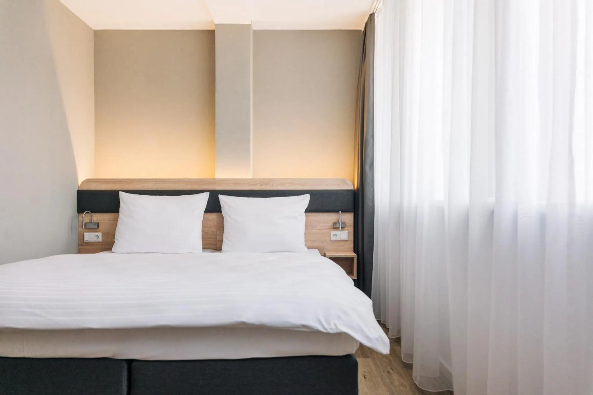 Bed in Homaris Corner Hotel