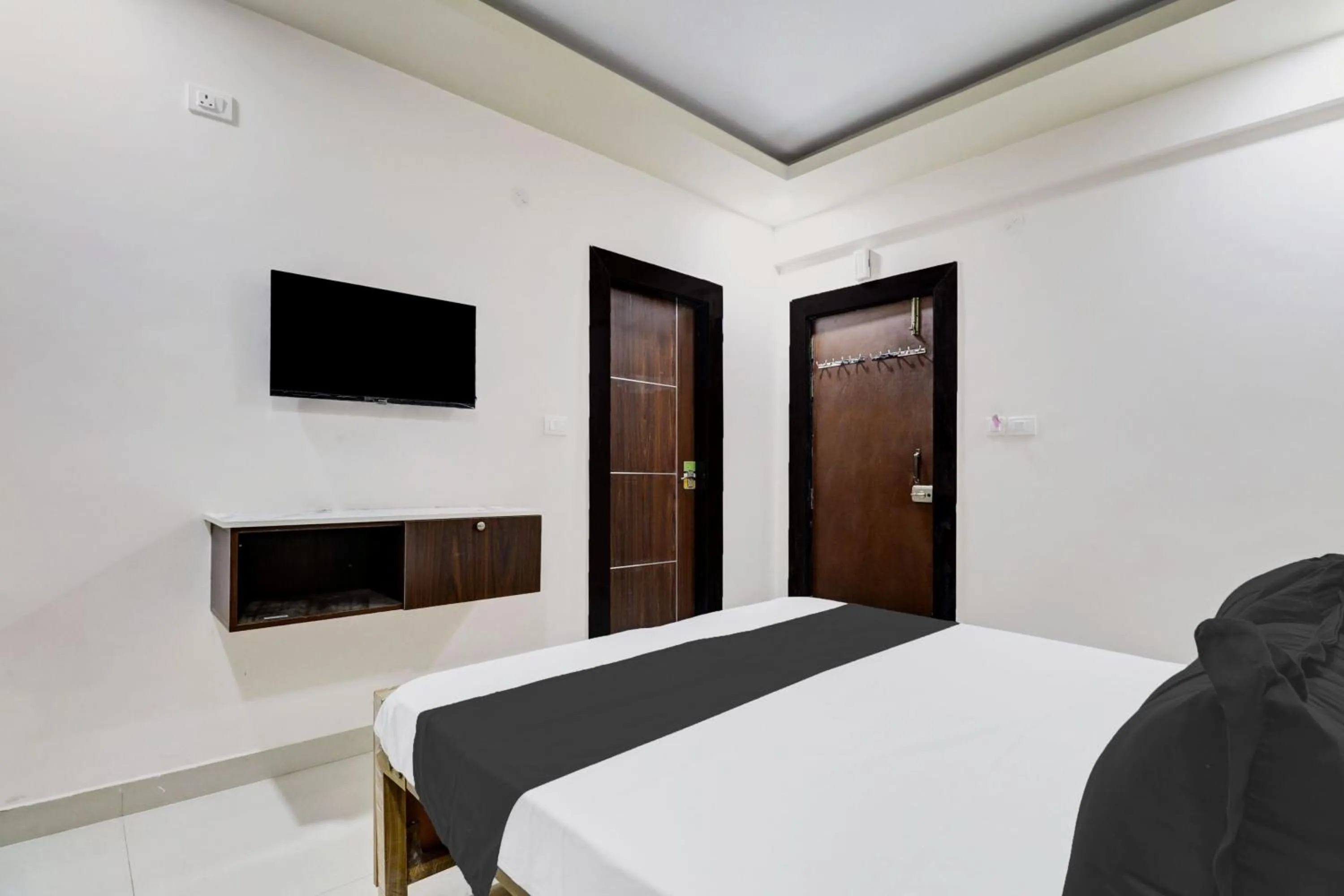 Bedroom in Hotel O Sri Harshitha Grand Near Zudio - Star Bazaar, Kundalhalli Gate