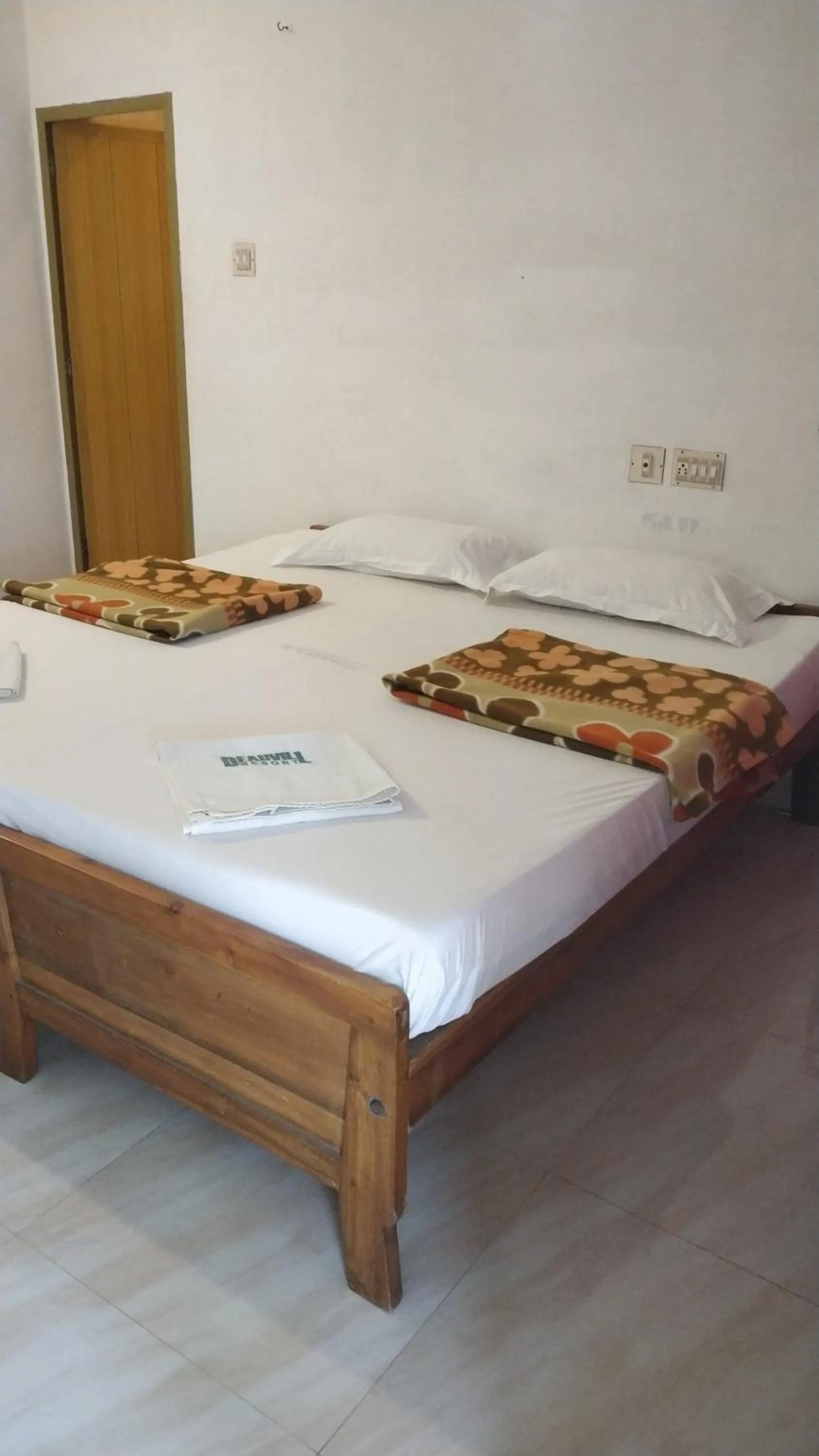 Bed in Deauvill Home Stay