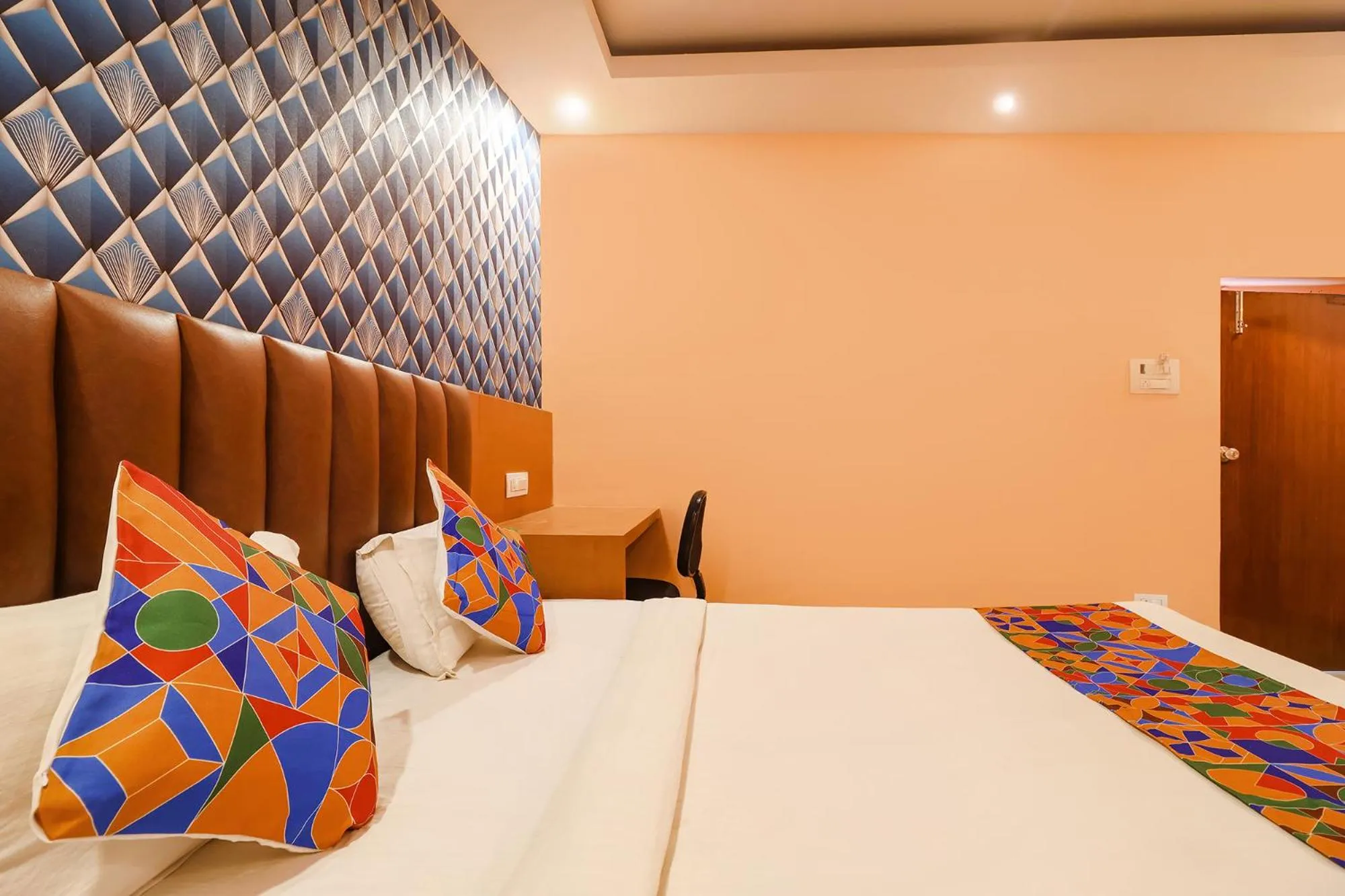 Bed in FabHotel Shanti International