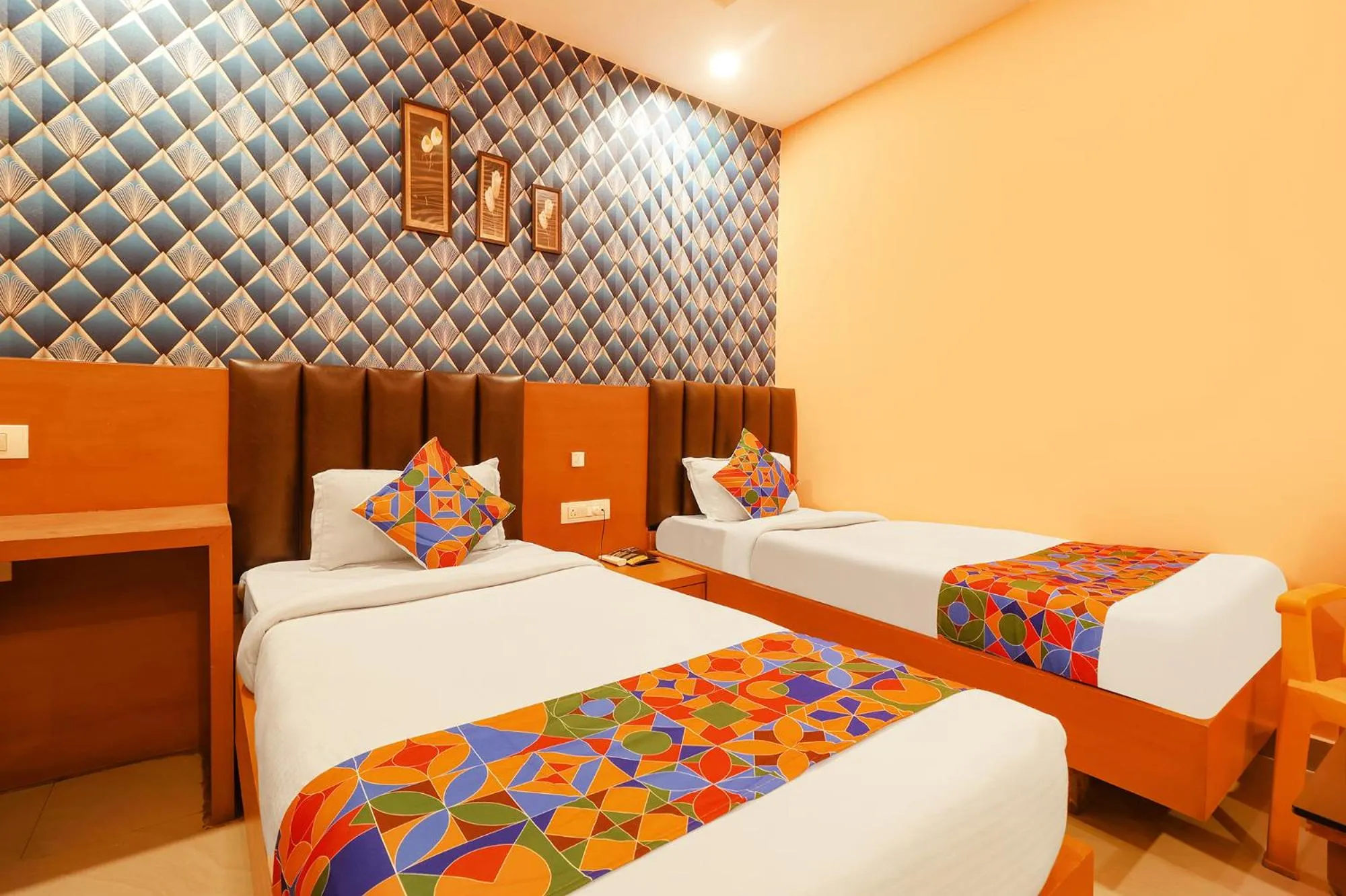 Bed in FabHotel Shanti International