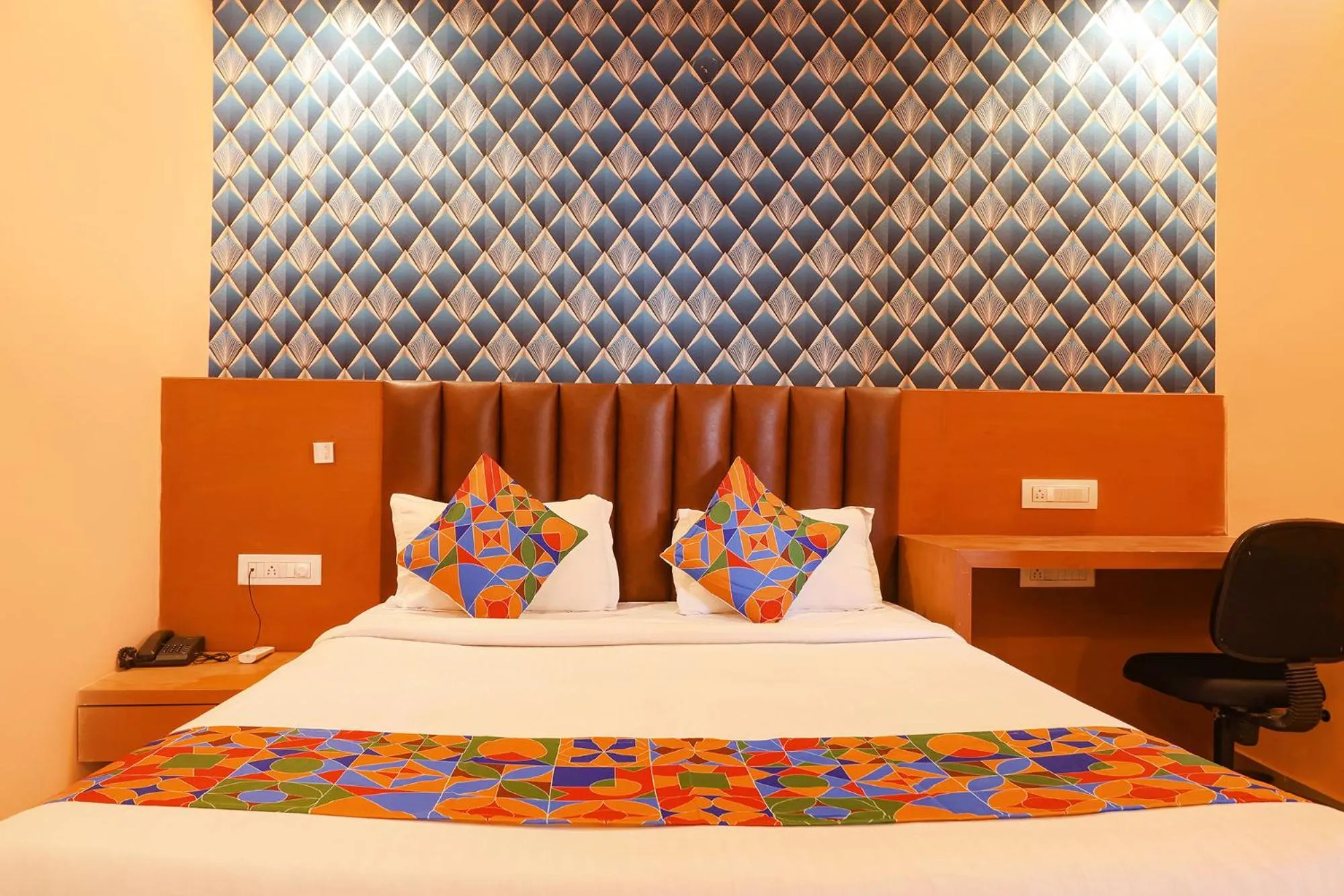 Bed in FabHotel Shanti International