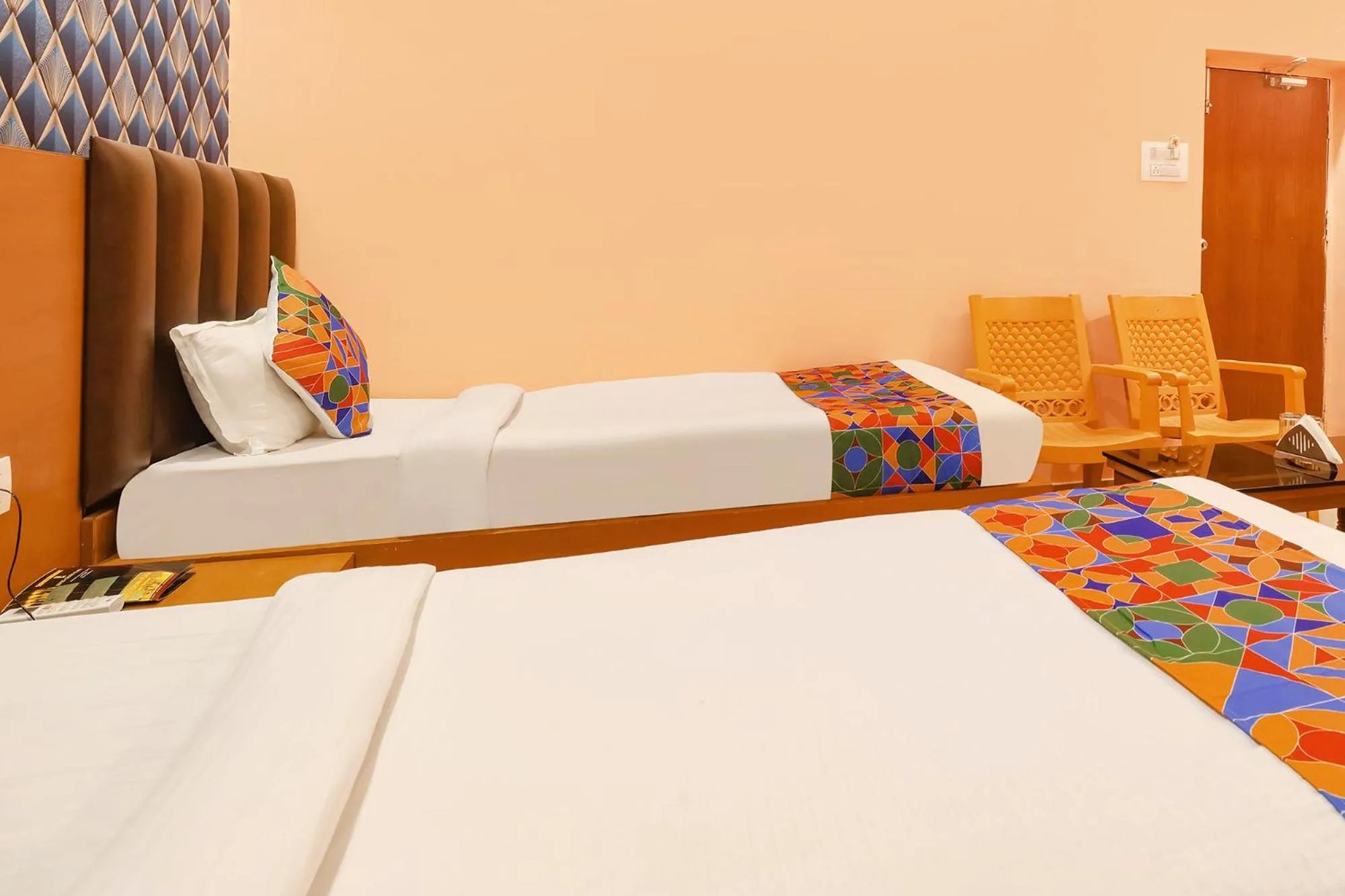 Bed in FabHotel Shanti International