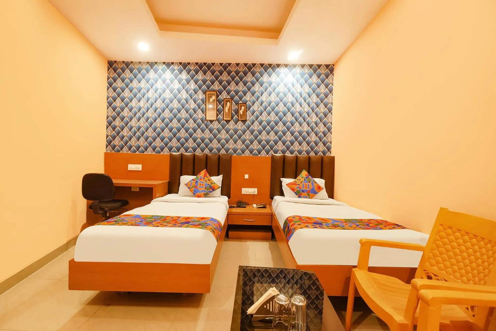 Bed in FabHotel Shanti International