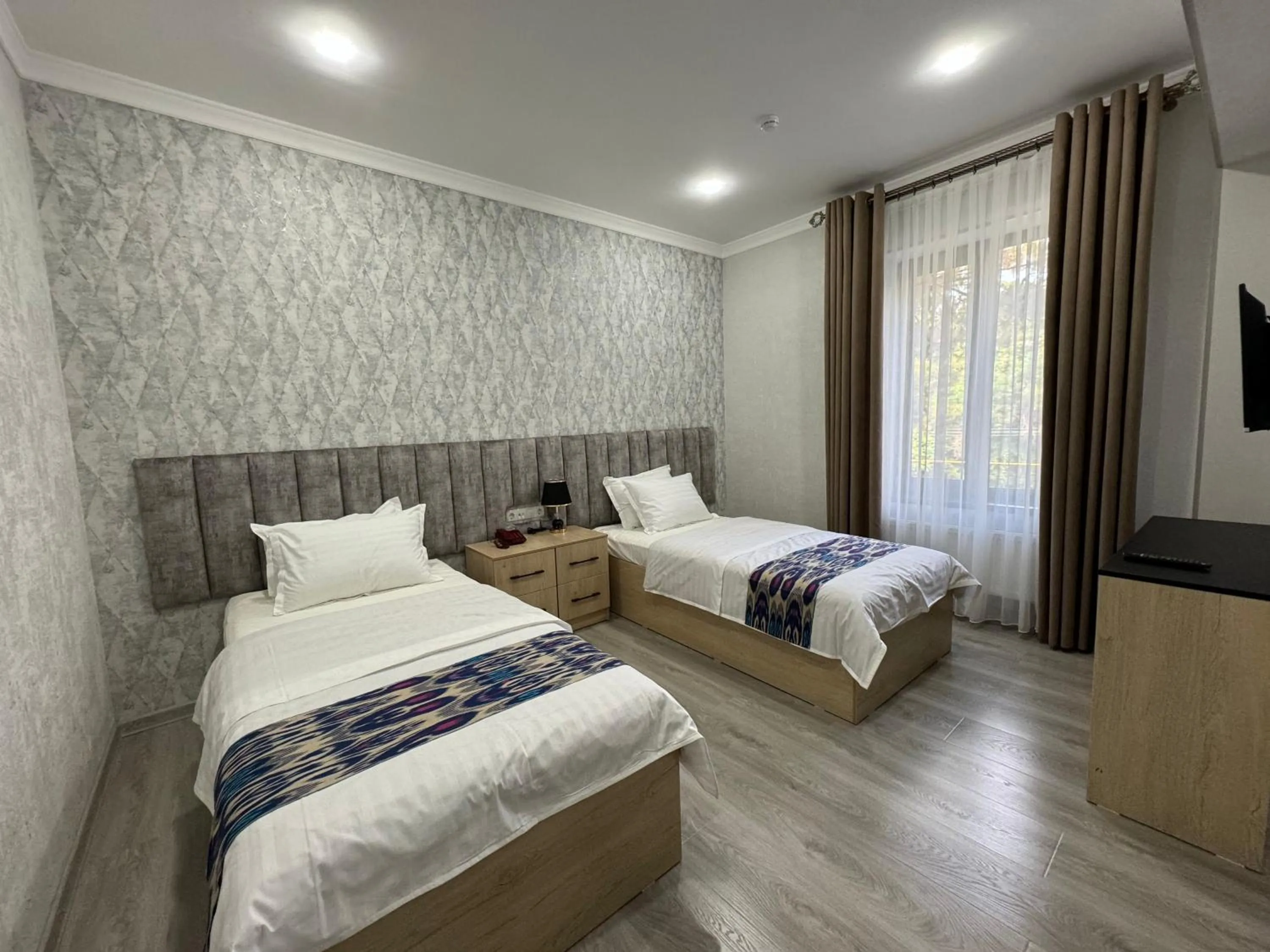 Bed in DSF GARDEN HOTEL