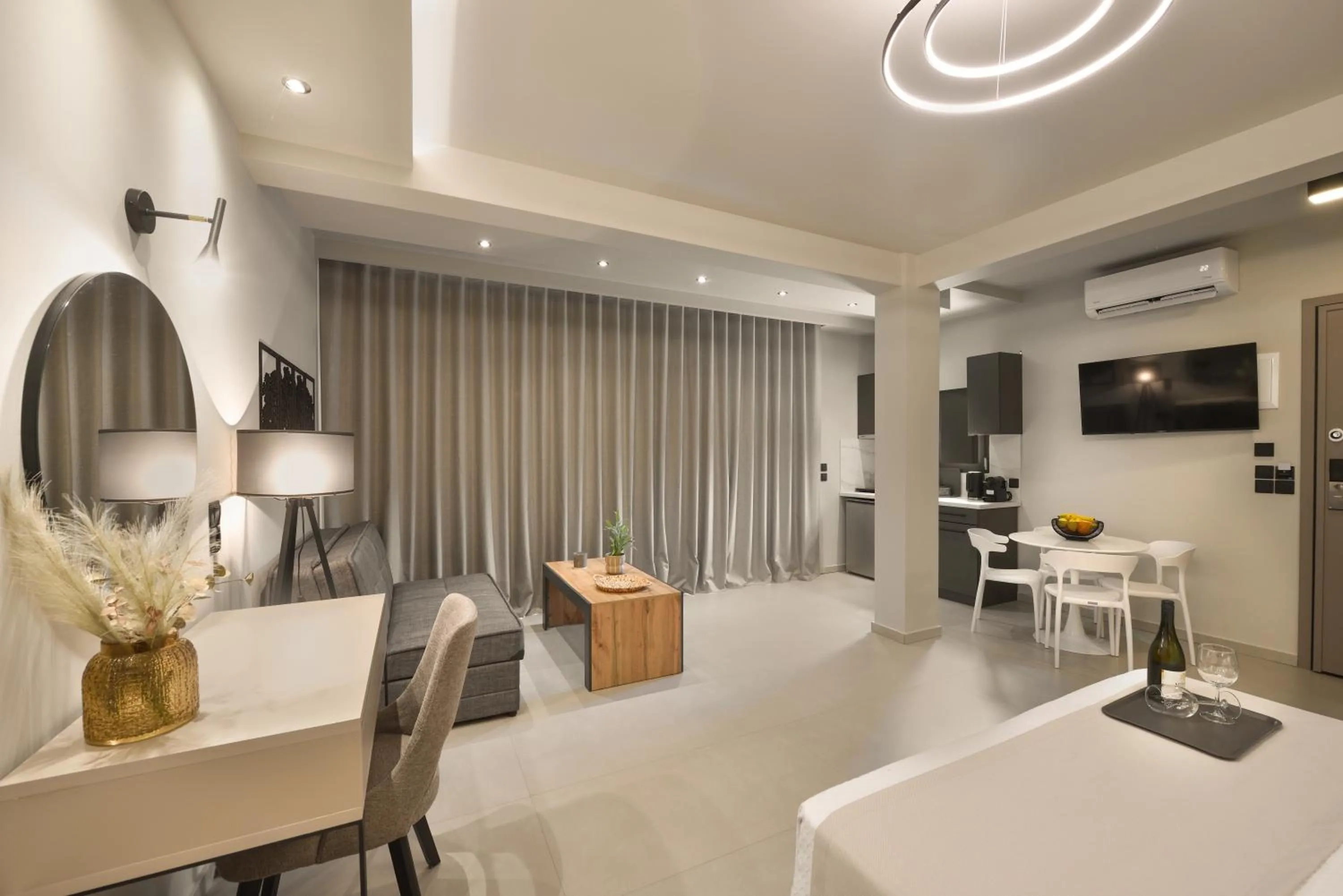 TV and multimedia in Olive All-Seasons Suites, Panel Hospitality Homes & Villas