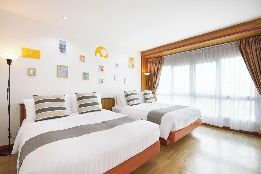 Bed in Cozy Donmueang Hotel