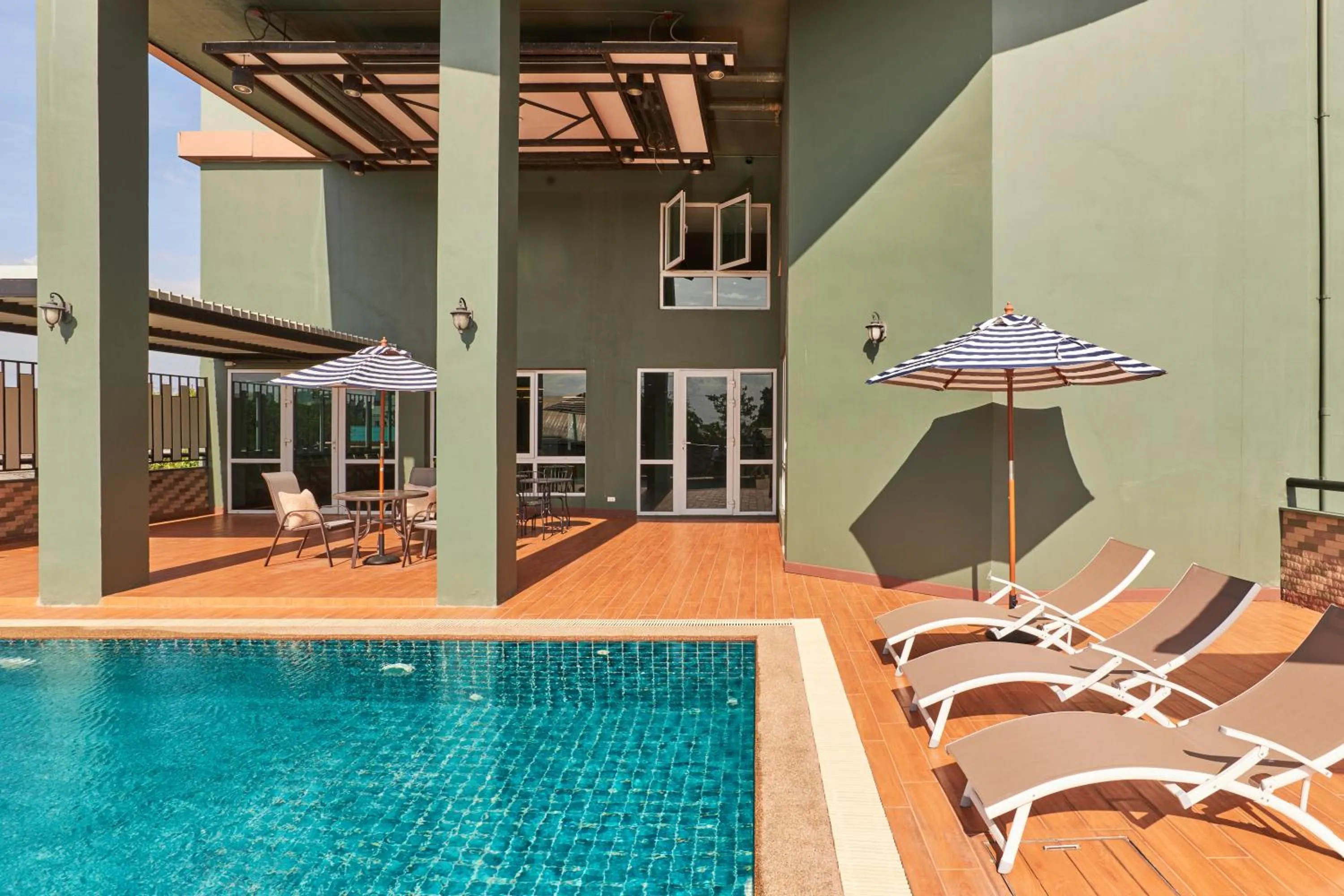 Swimming pool in NJOY Prestige Grand Hotel Don Mueang