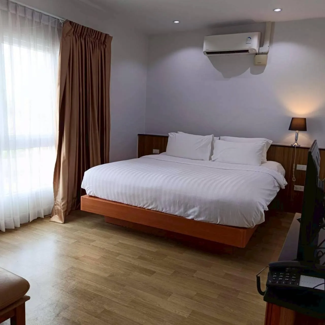 Bed in Cozy Donmueang Hotel