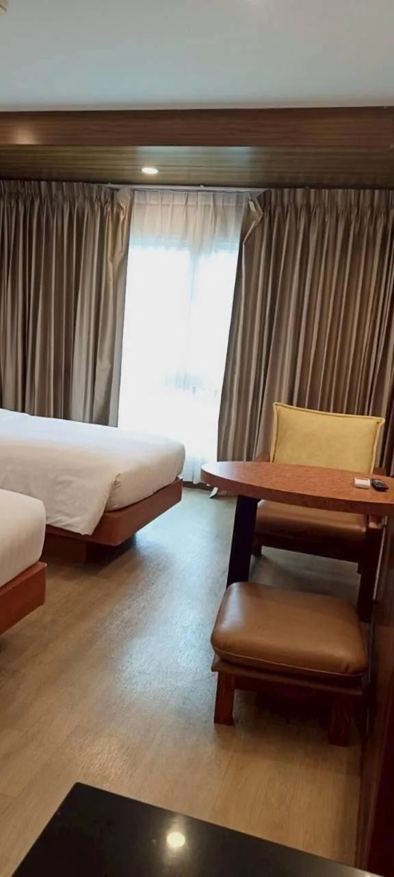 Bed in Cozy Donmueang Hotel