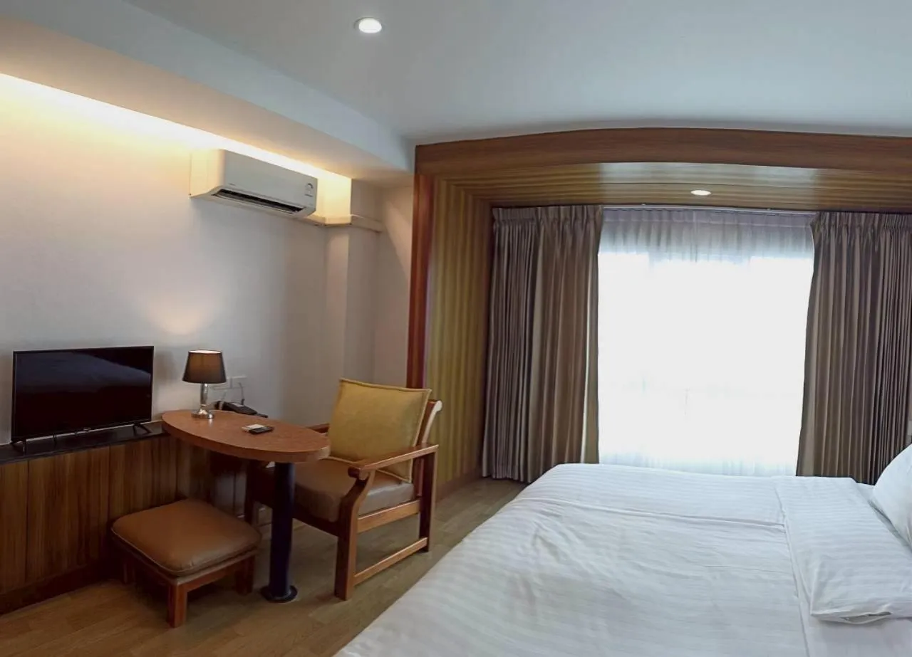 Bed in Cozy Donmueang Hotel