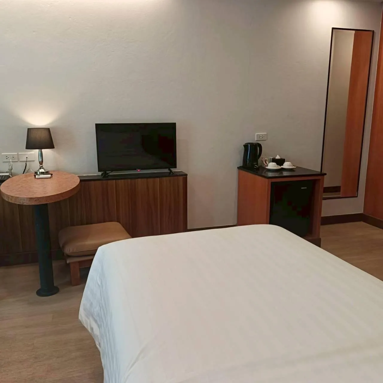 Bed in Cozy Donmueang Hotel