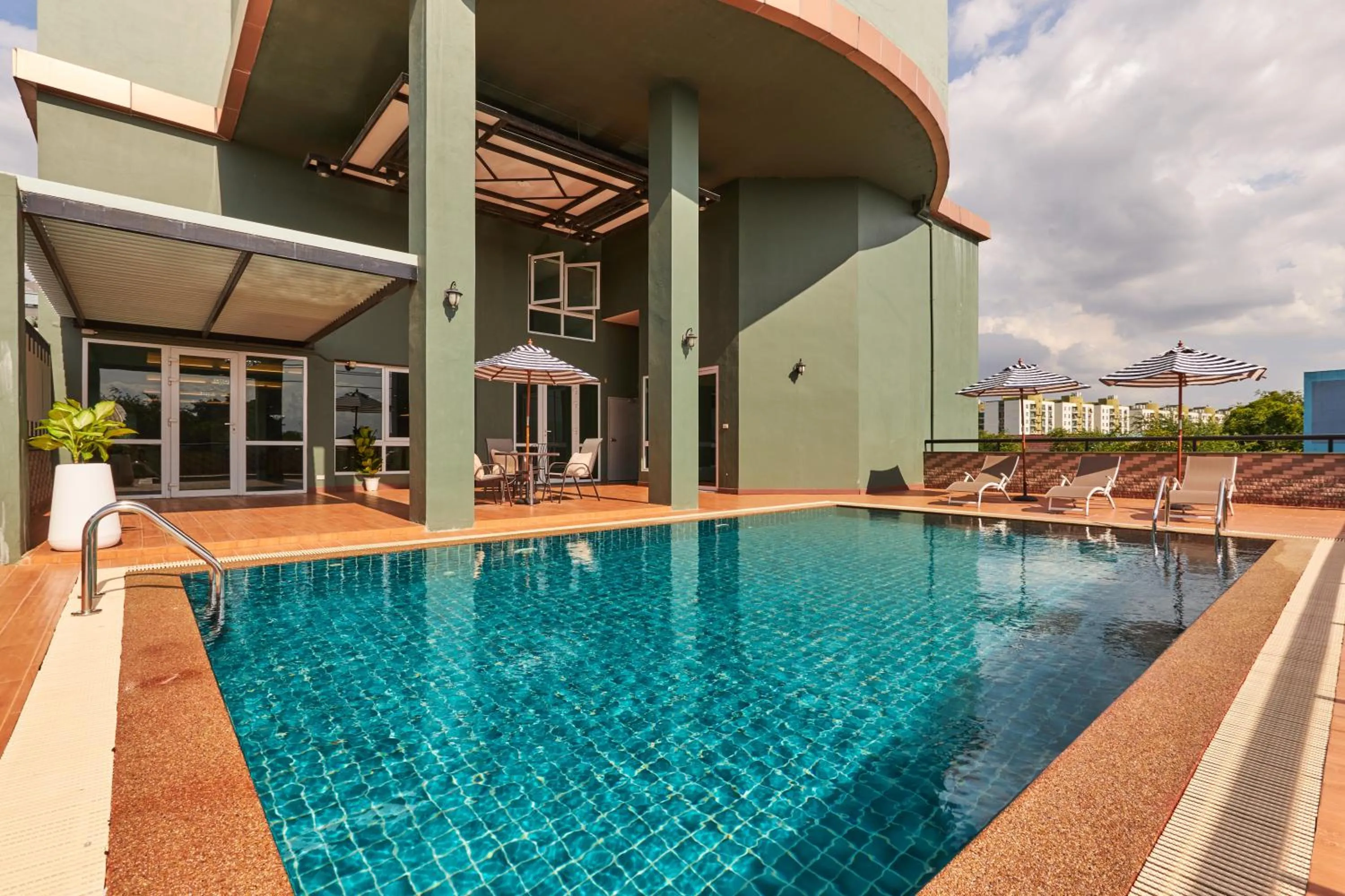 Swimming pool in NJOY Prestige Grand Hotel Don Mueang