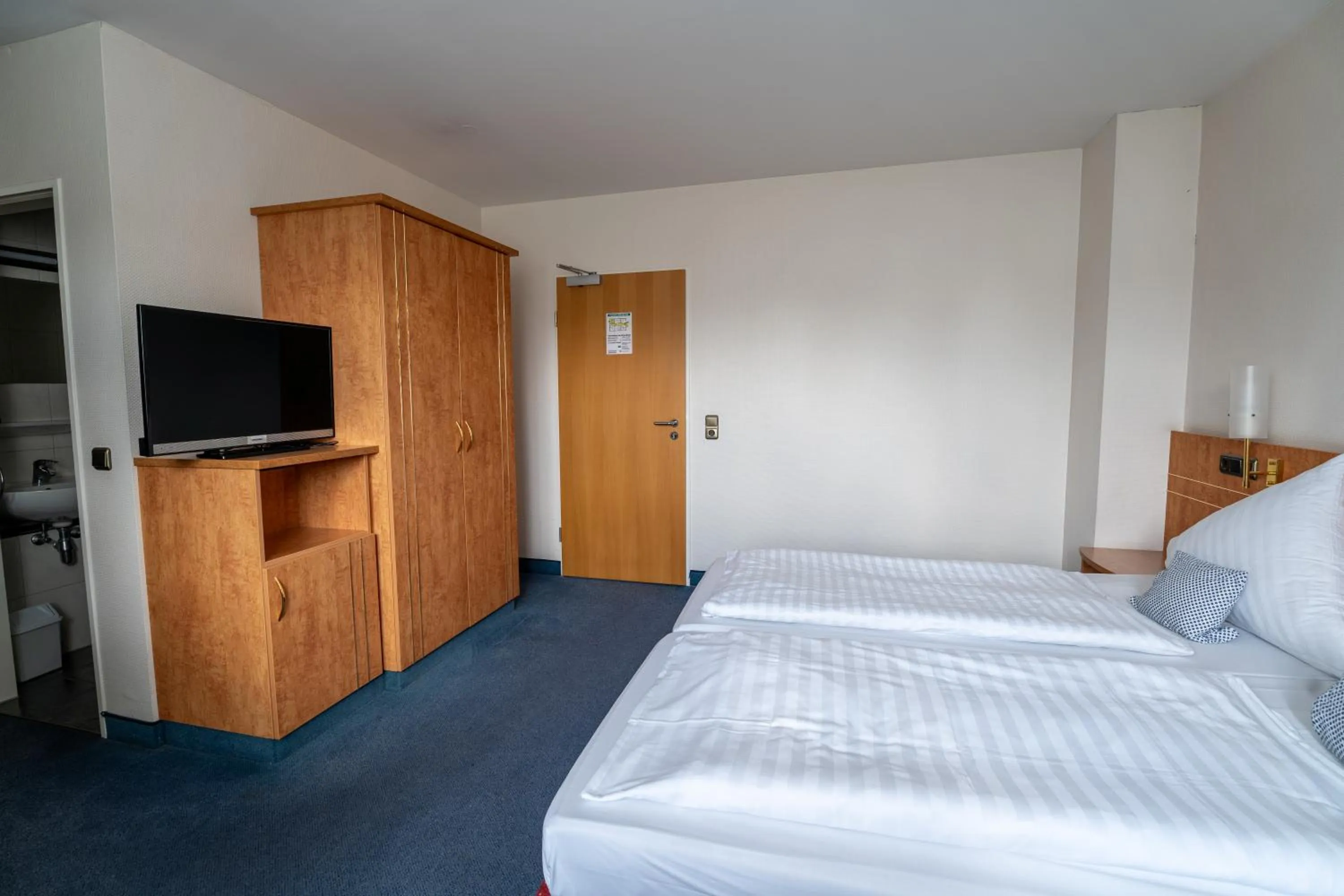 Bed in Airport Business Hotel Köln