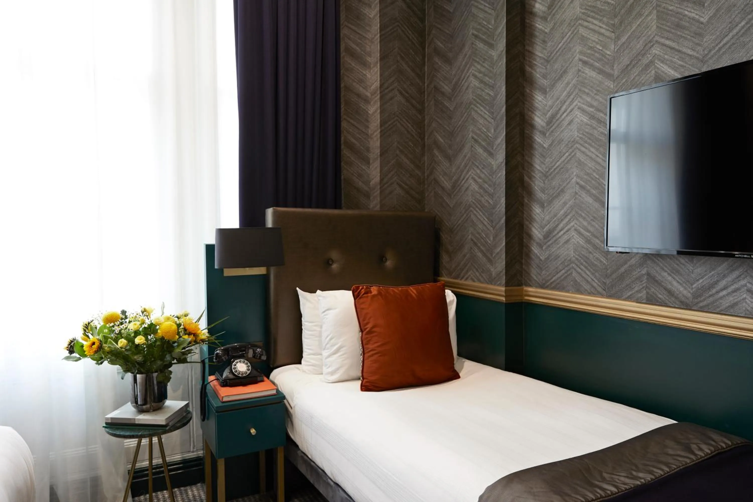 Bed in The Portico Hotel