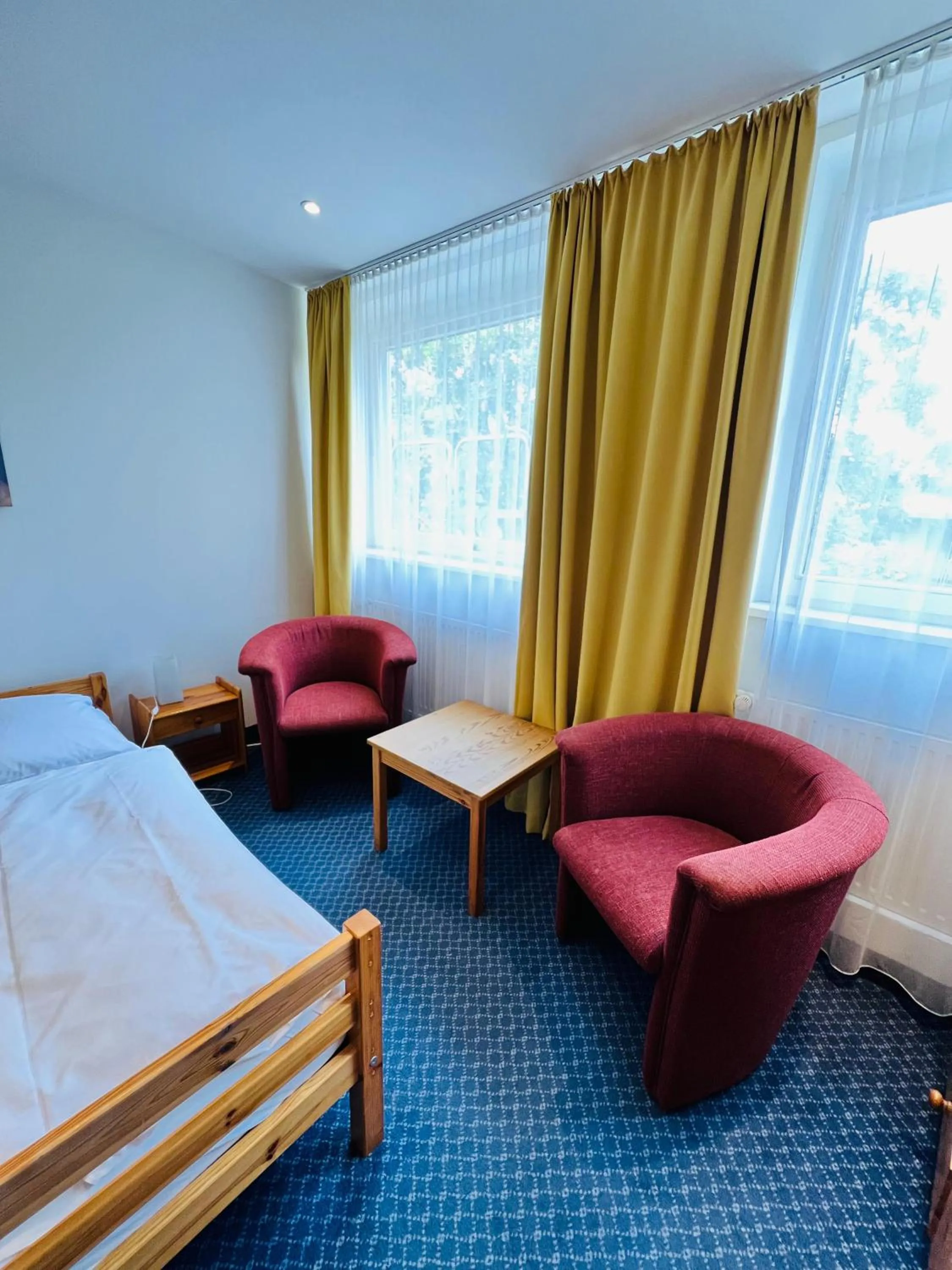 Seating area, Bed in City Apartment Hotel Hamburg