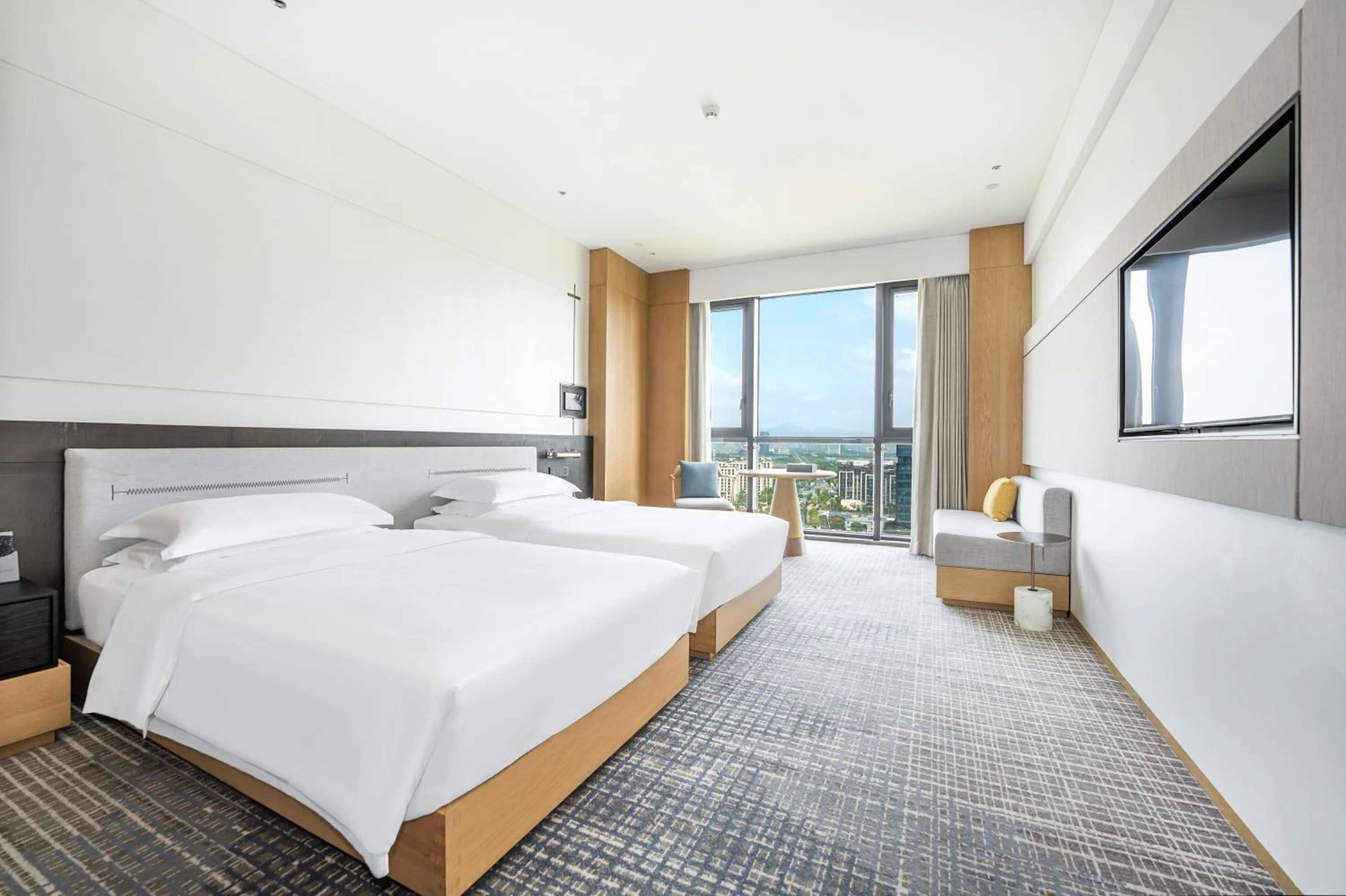 Bed in Holiday Inn Ningbo Xiangshan Damu Bay by IHG