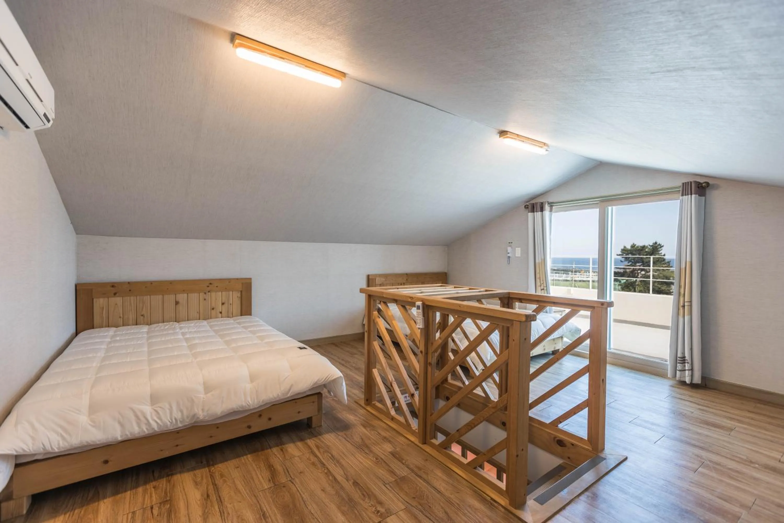 Bed in Jeju Pine Beach Pension