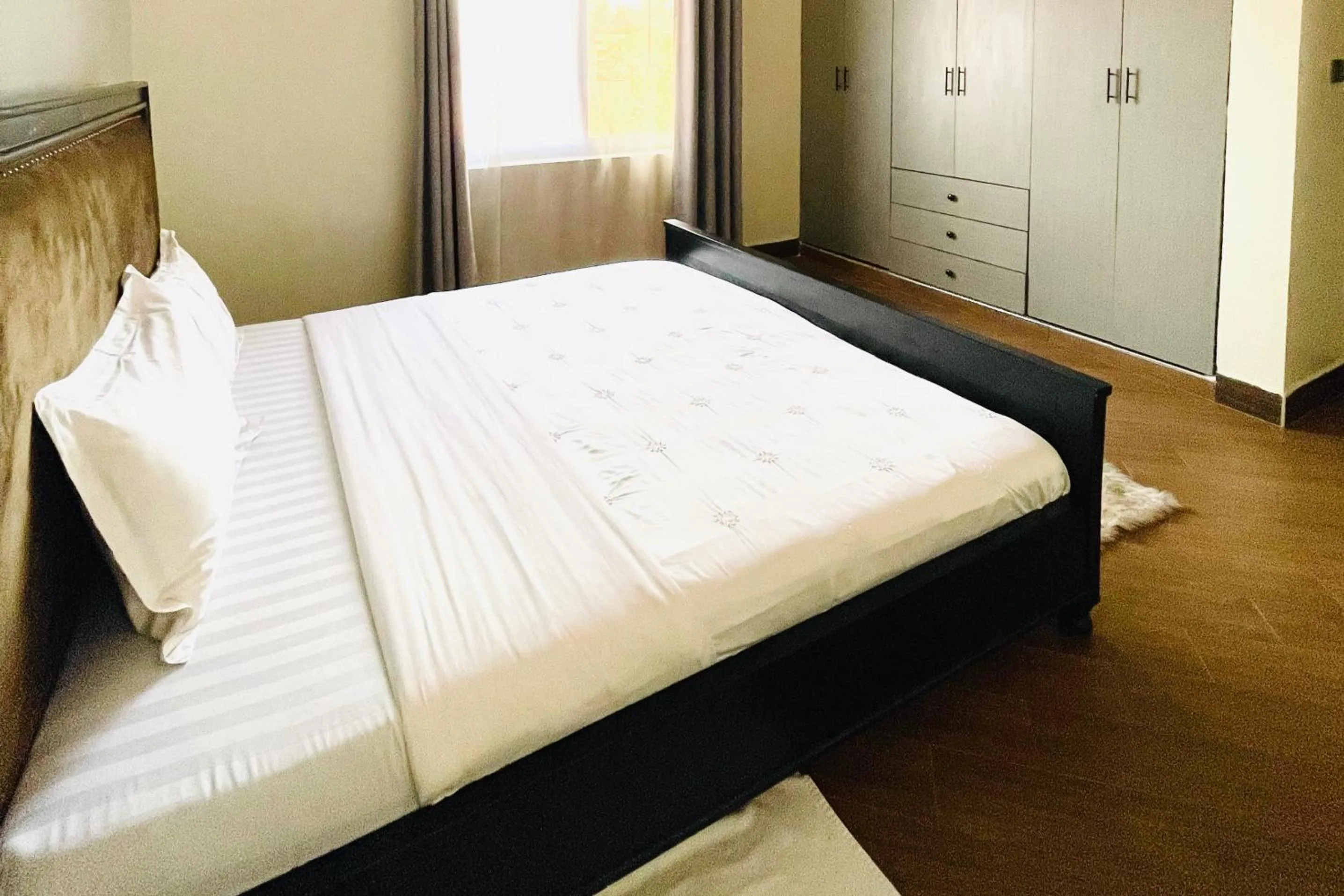 Bed in Cozy Kampala Apartment with Great Views