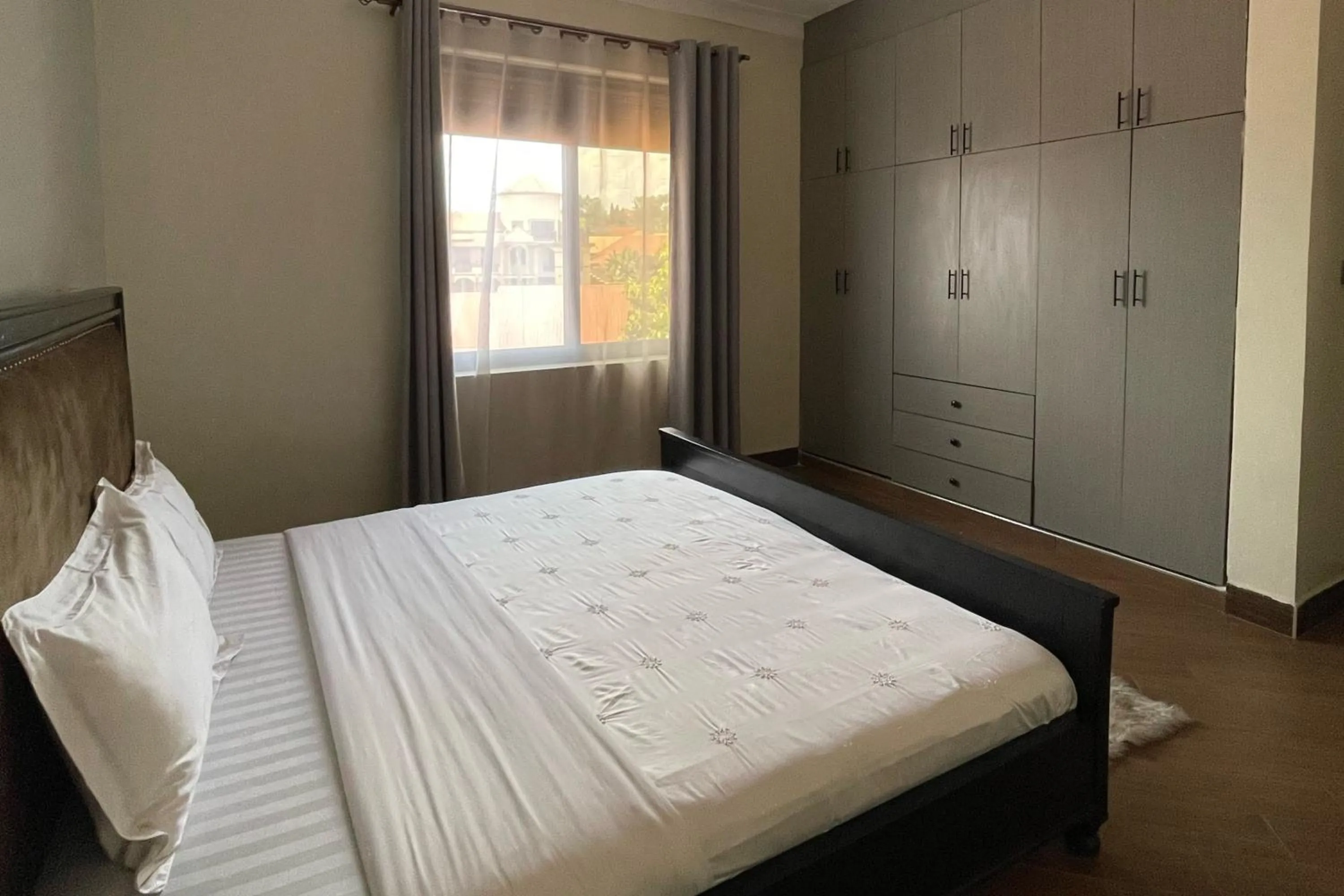 Bed in Cozy Kampala Apartment with Great Views