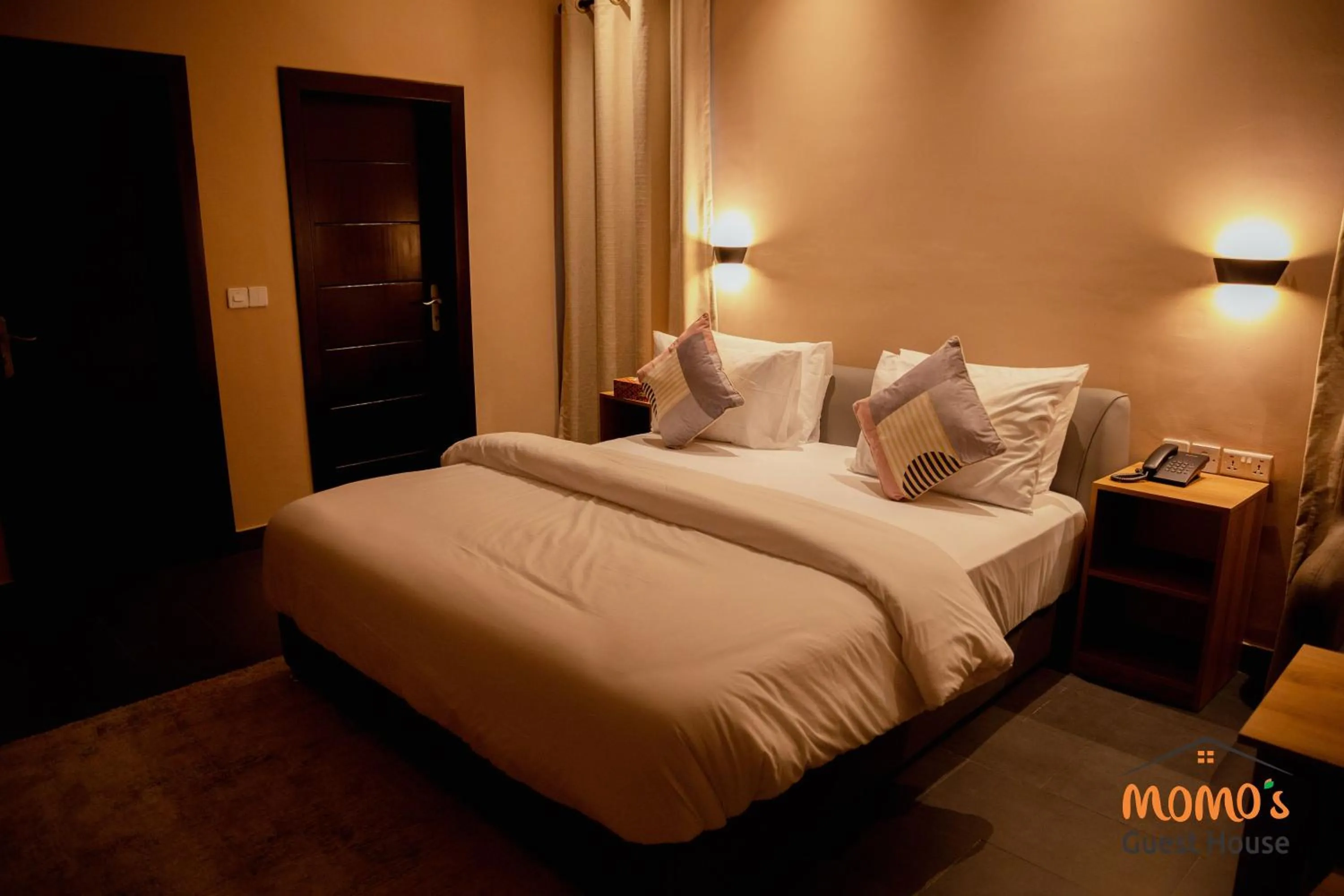 Bed in Momo's Hotel