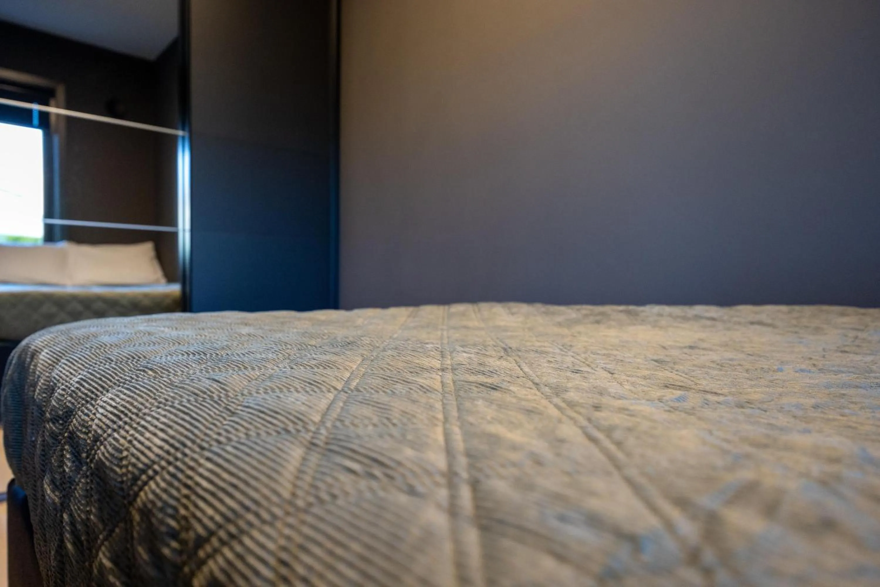 Bed in Florø Apartments Hotell