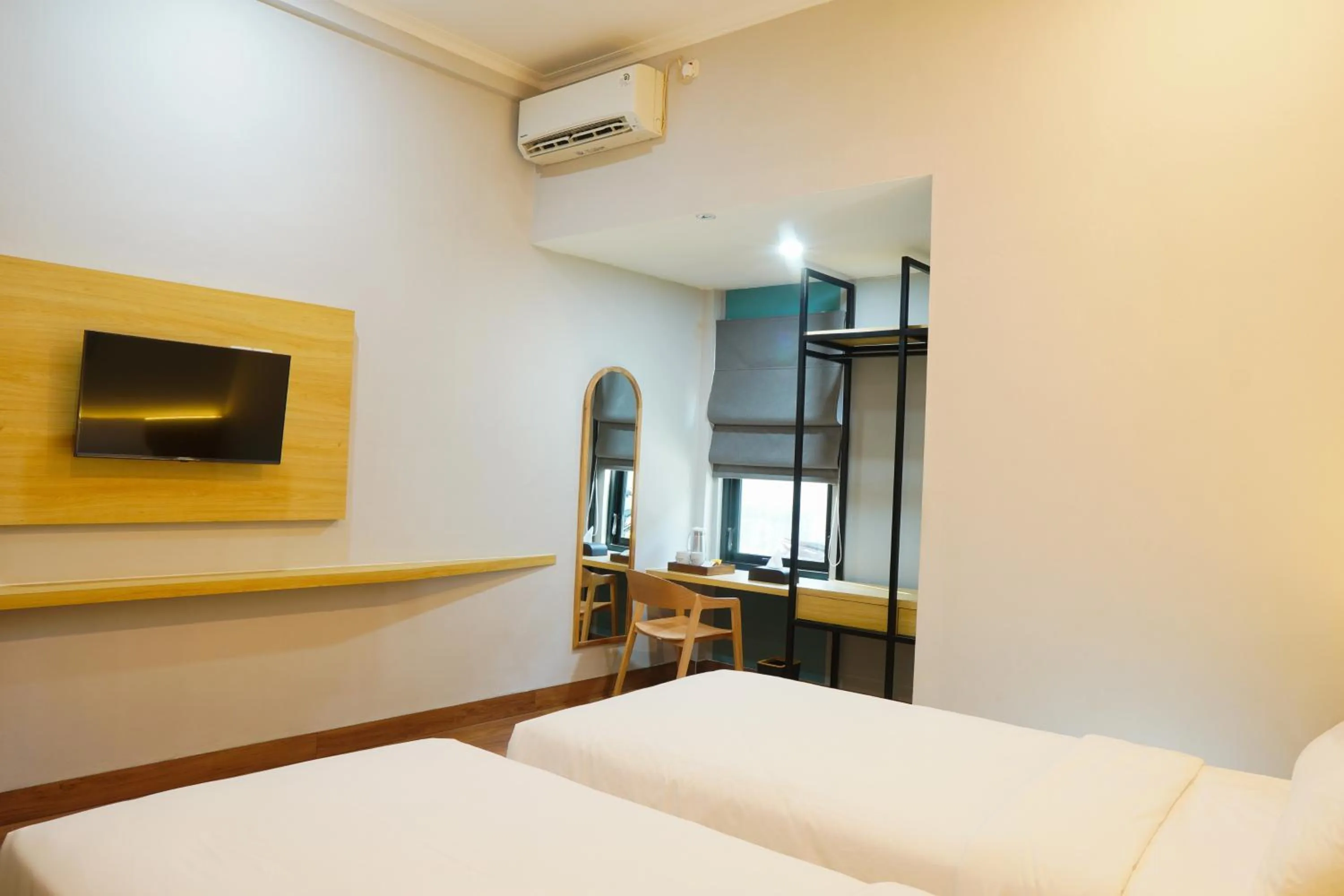 Bed in Ardiana Suite Hotel By Sajiwa