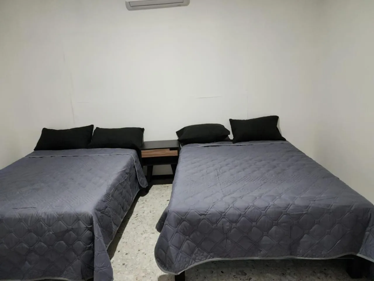 Bed in JESAVI Suites