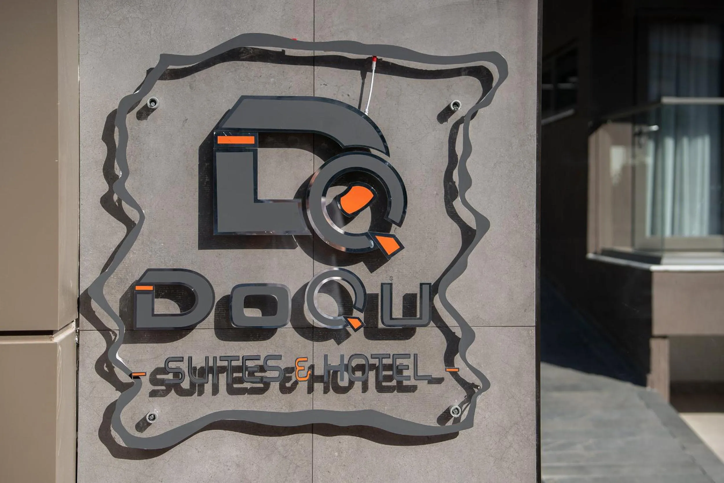 Property logo or sign in Doqu Suites Hotel