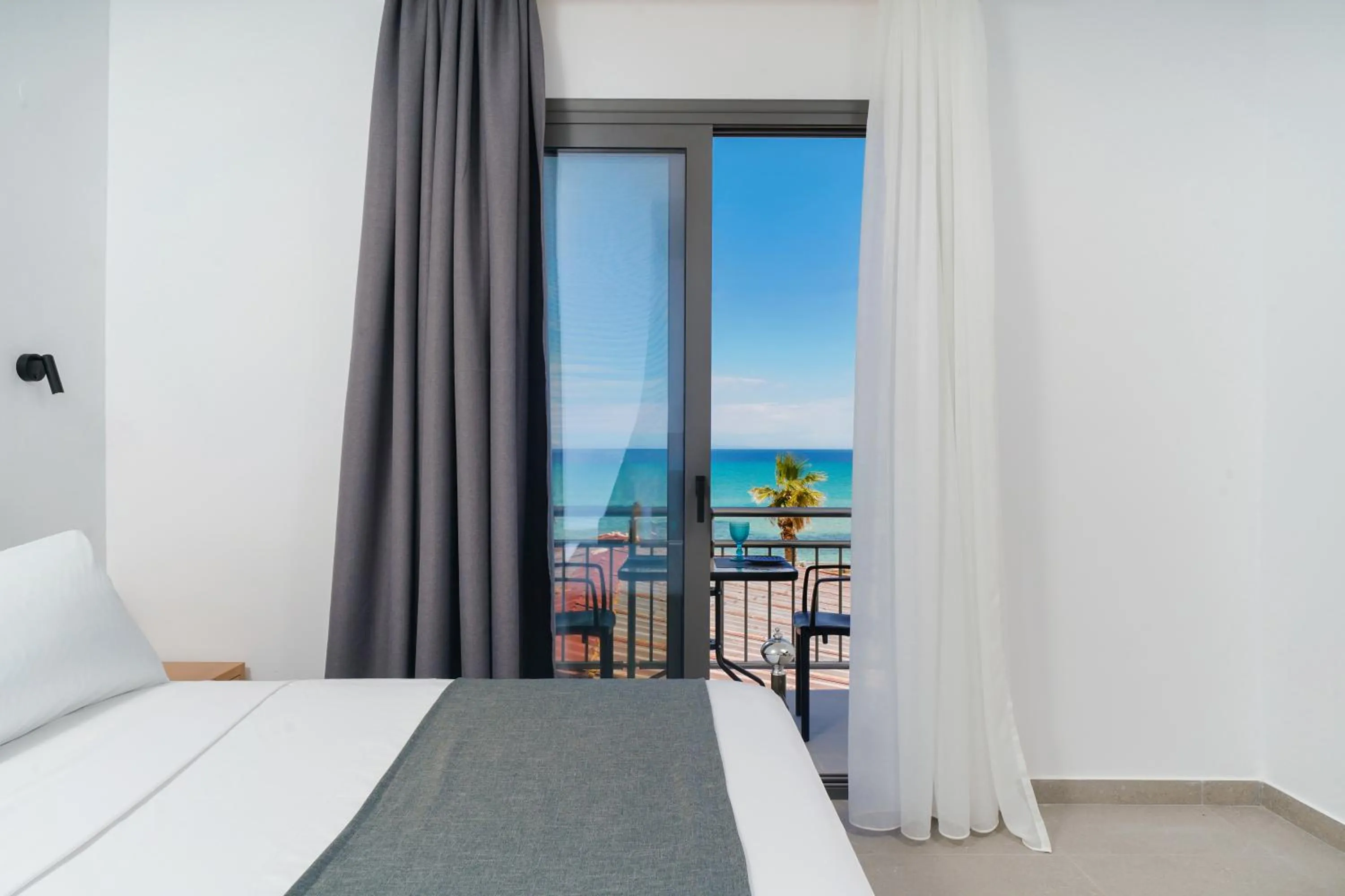 Bed in Emerial Deluxe Seaside Rooms