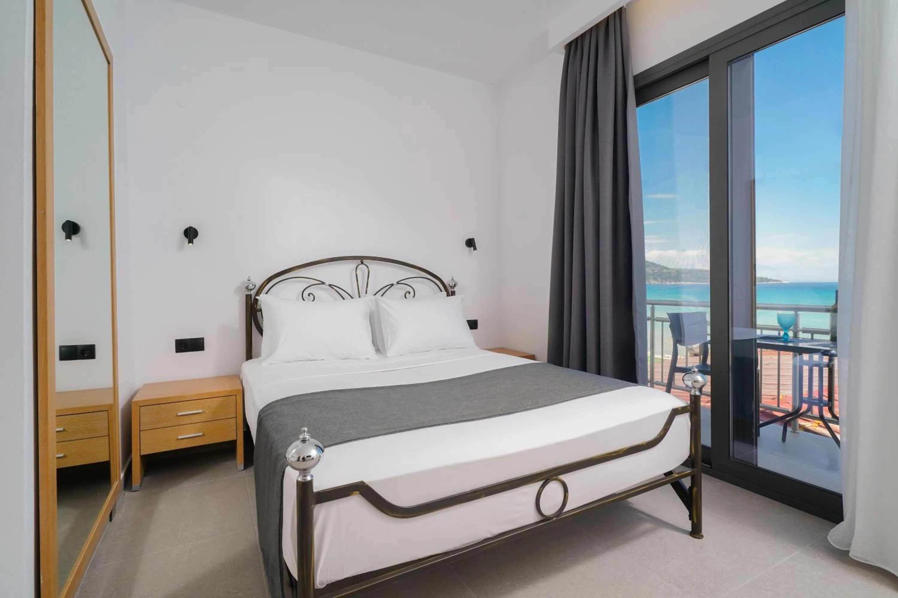 Bed in Emerial Deluxe Seaside Rooms