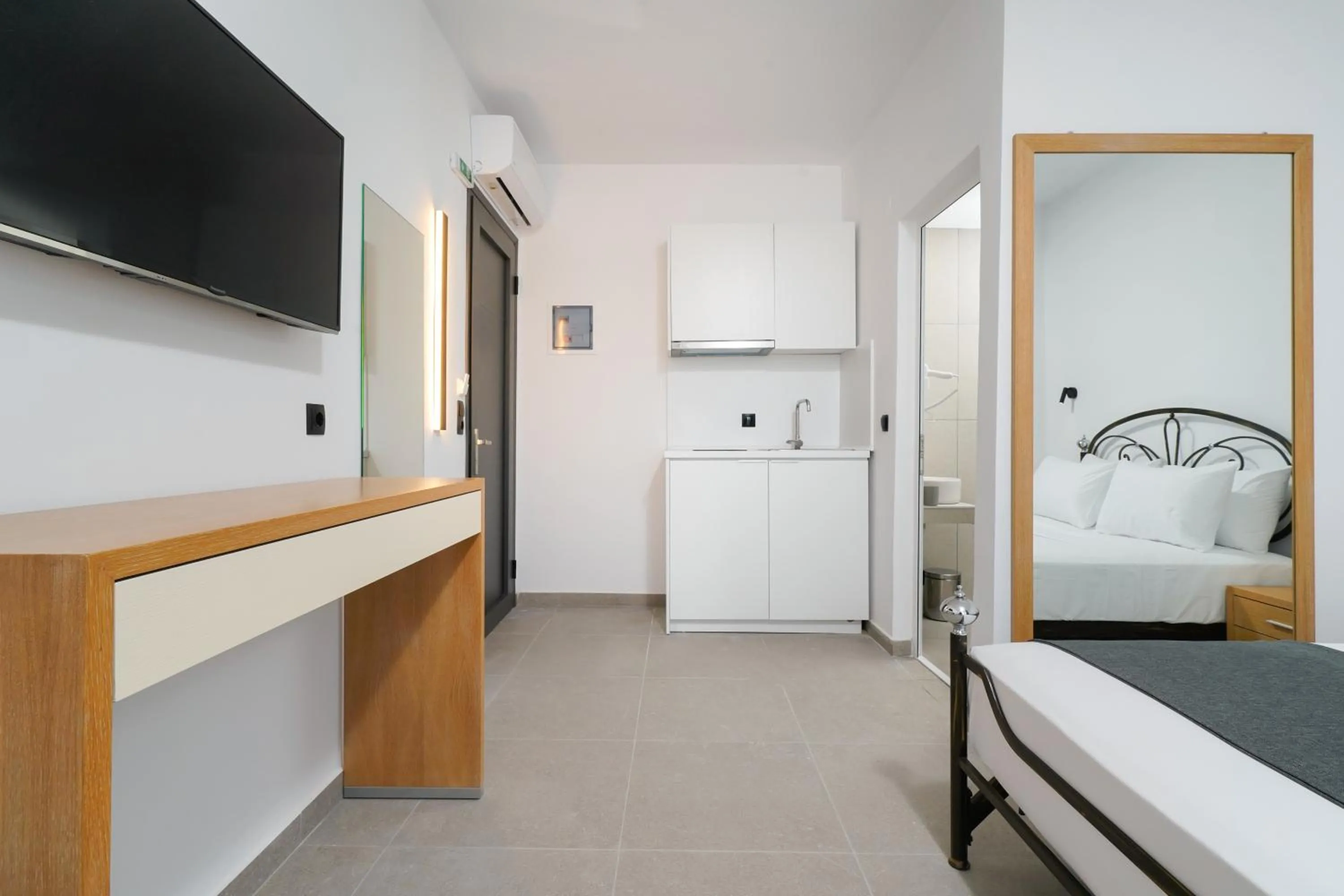 Bed in Emerial Deluxe Seaside Rooms