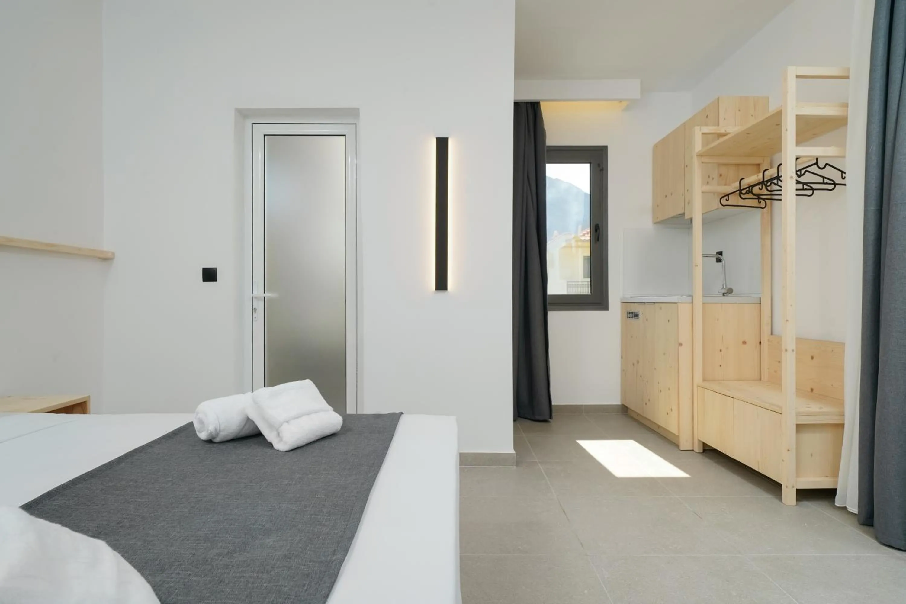 Bed in Emerial Deluxe Seaside Rooms