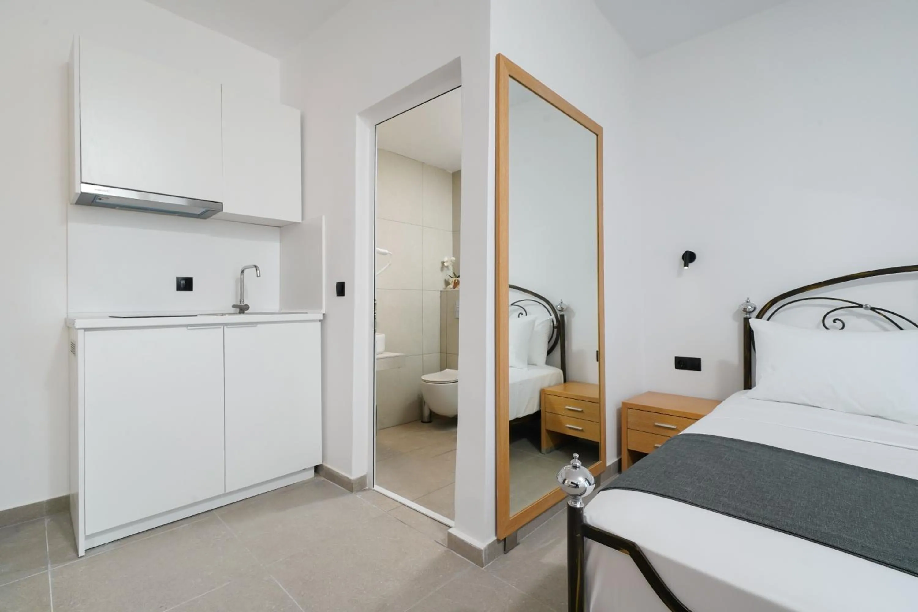 Bed in Emerial Deluxe Seaside Rooms