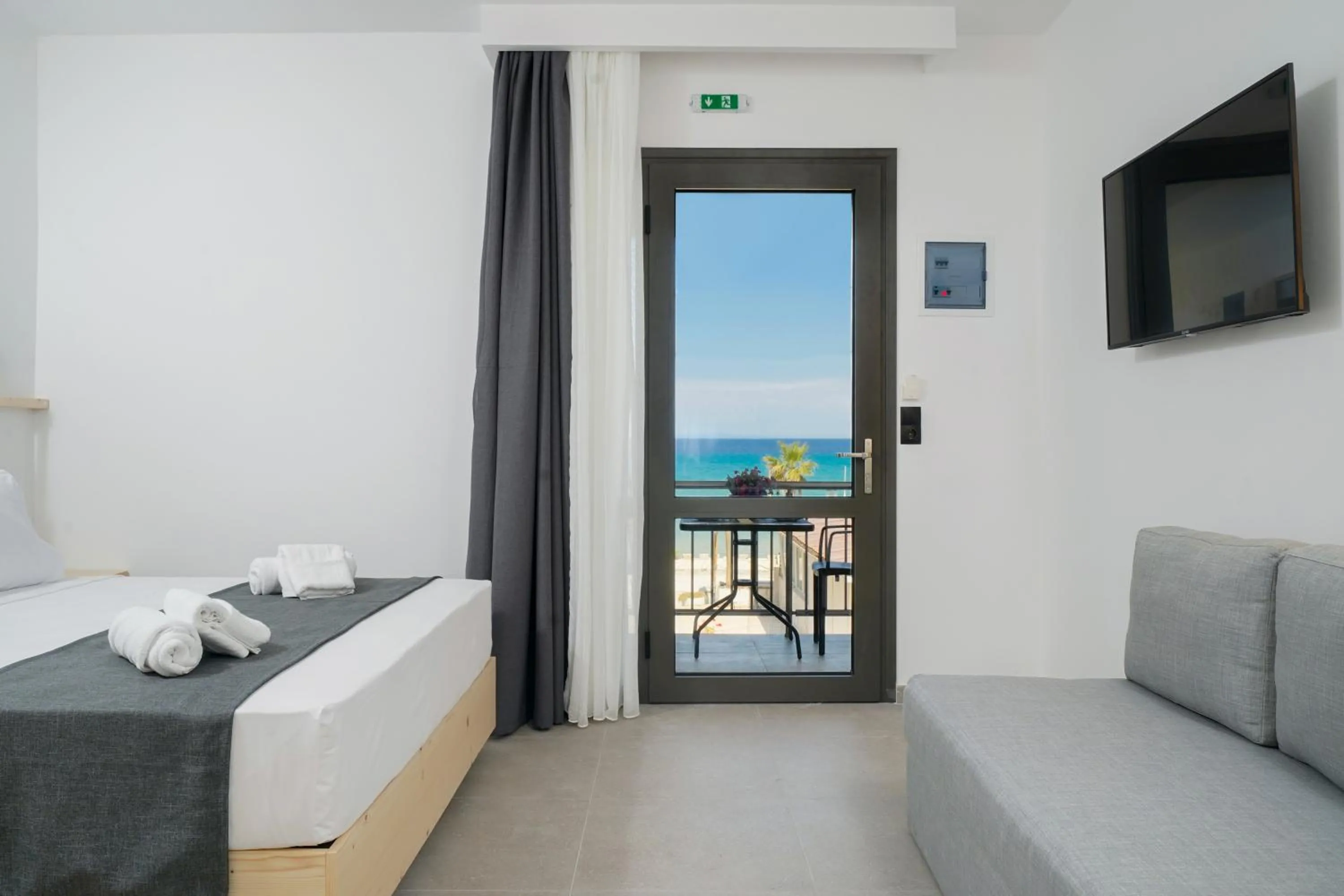 Bed in Emerial Deluxe Seaside Rooms