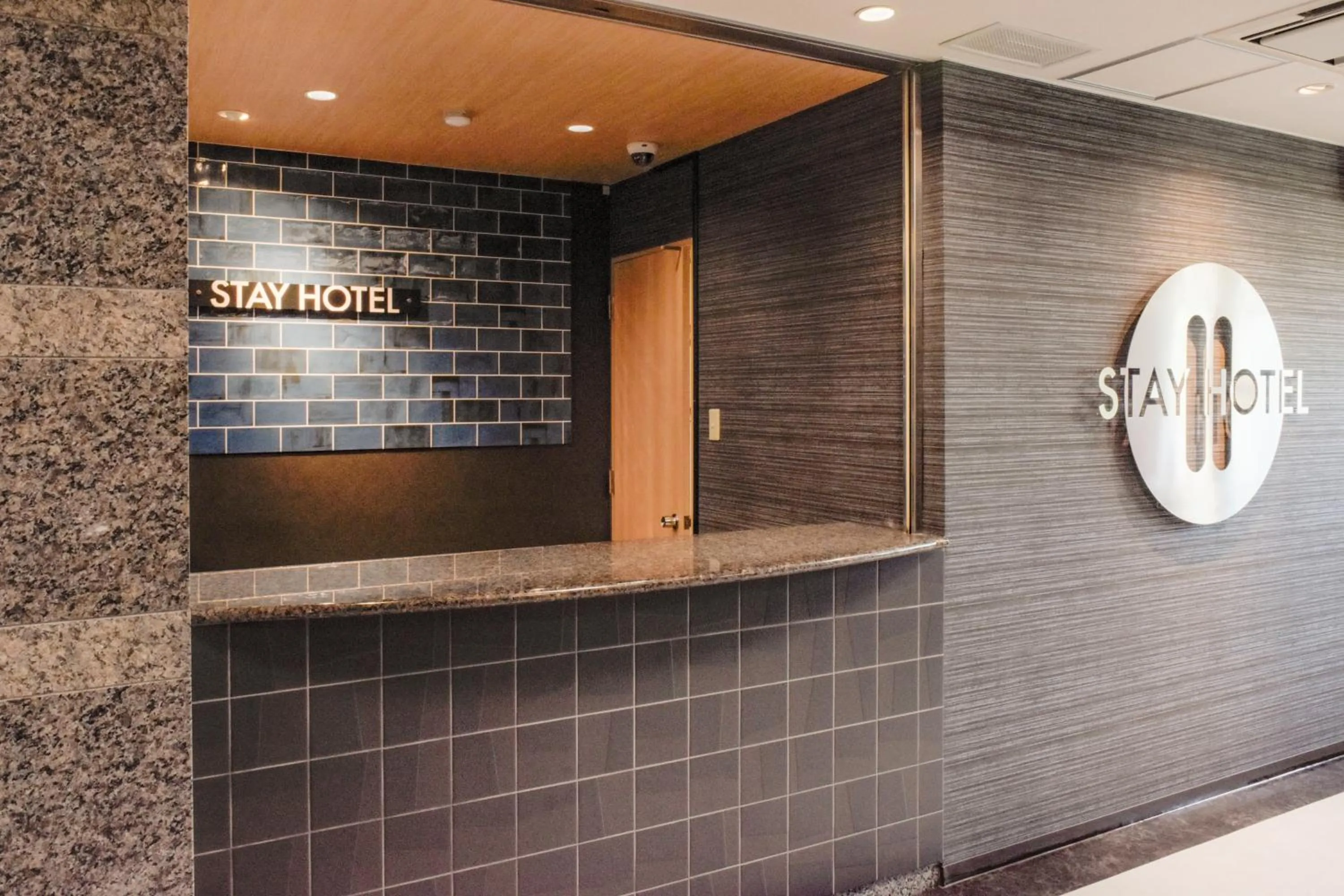 Property logo or sign in Stay HOTEL