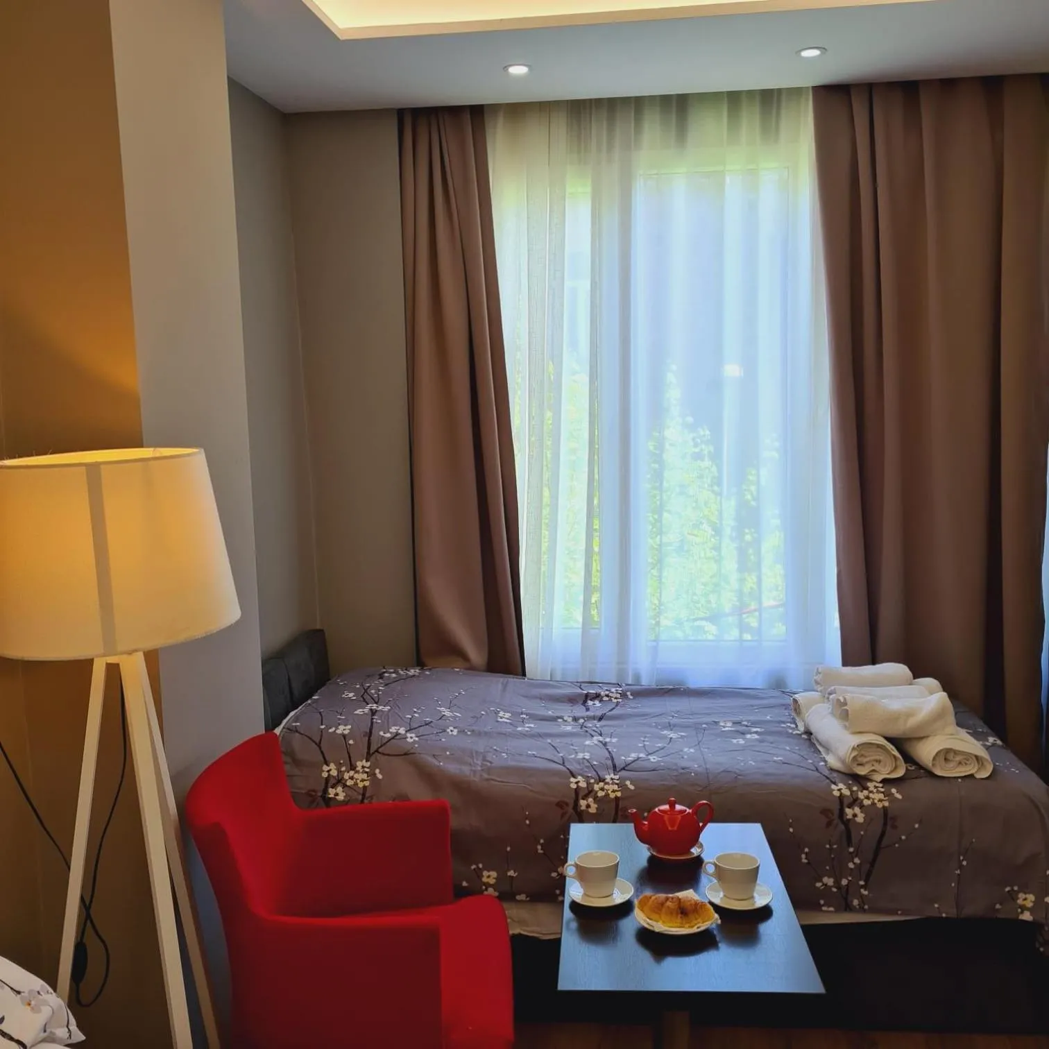 Seating area, Bed in Driti Central Hotel