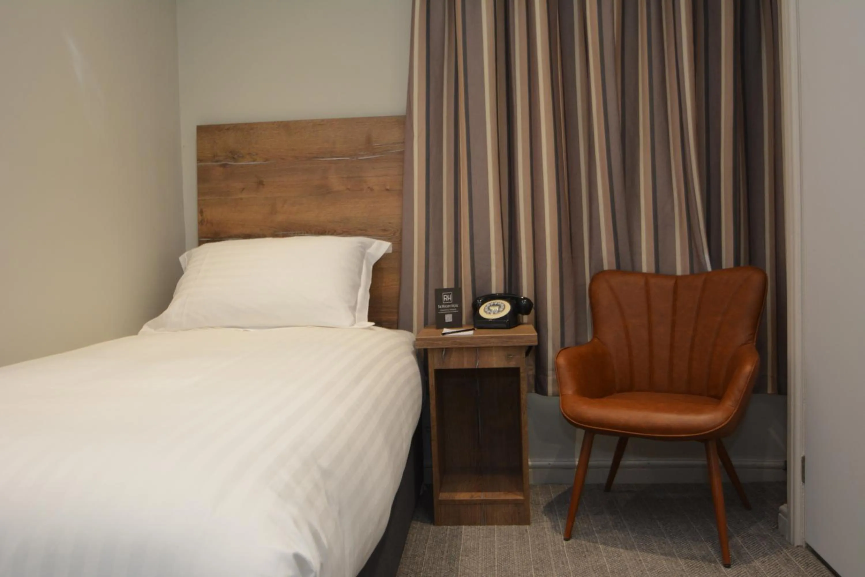 Bed in The Rugby Hotel