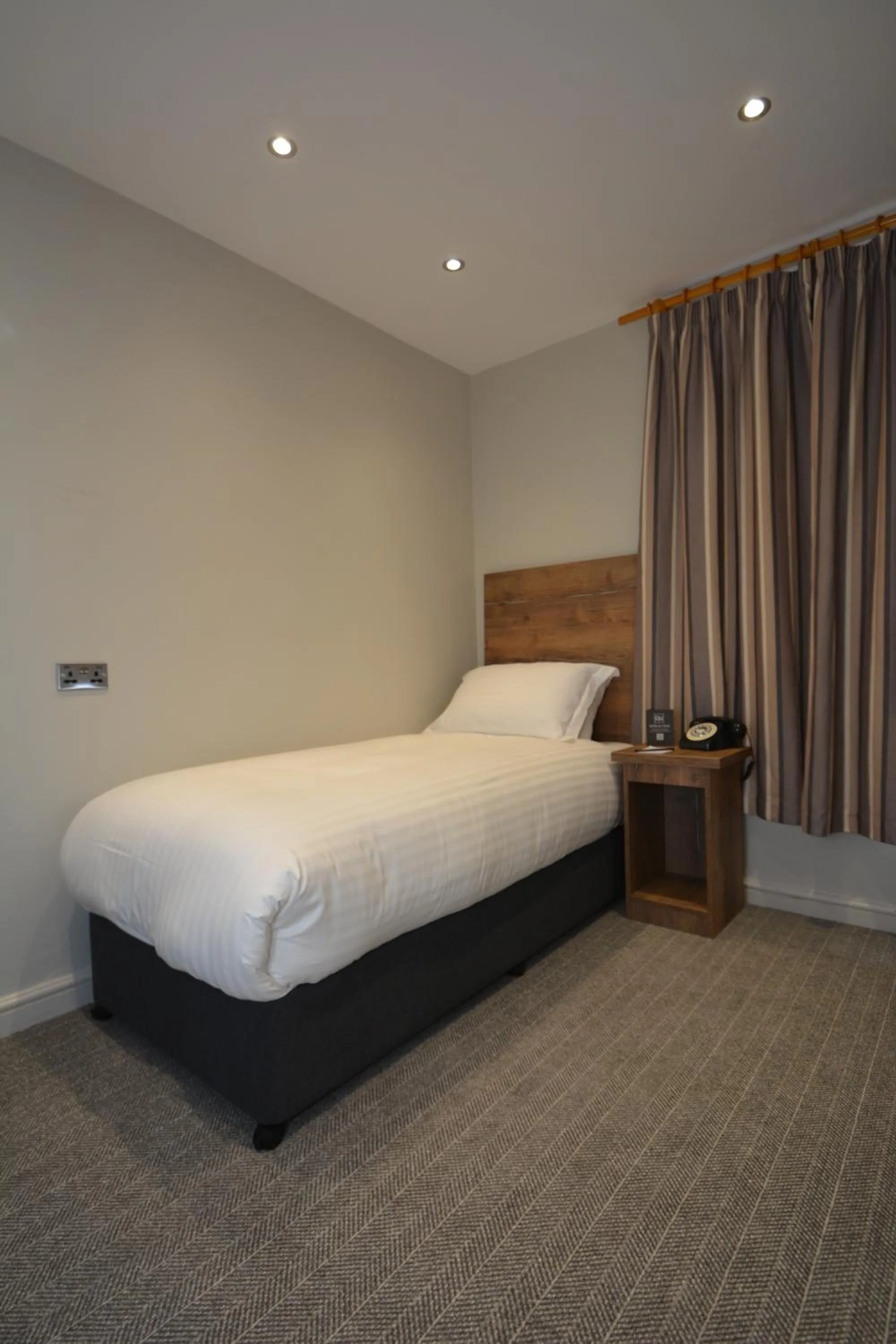 Bed in The Rugby Hotel