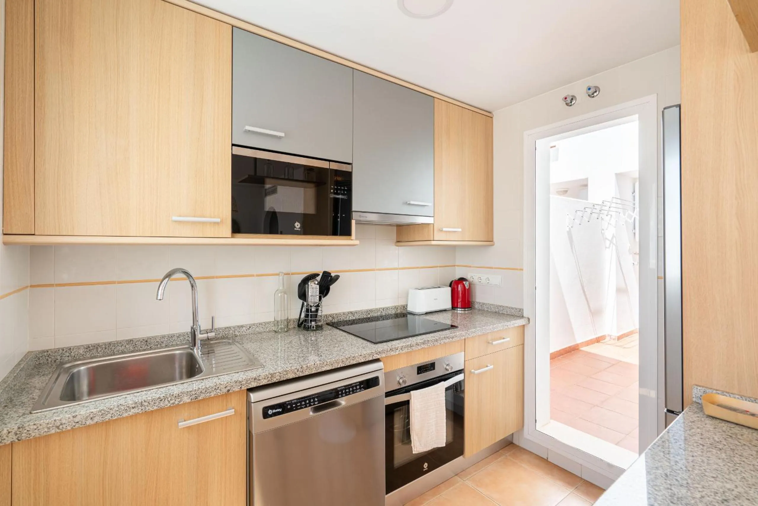 Kitchen or kitchenette in AlmeriaSuite Mojacar Breeze Apartments