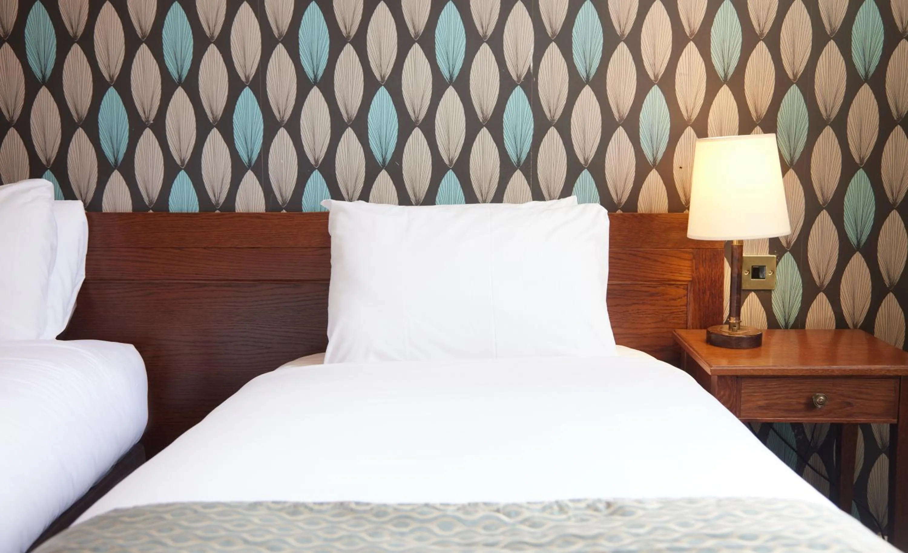 Bed in Cock Hotel by Greene King Inns